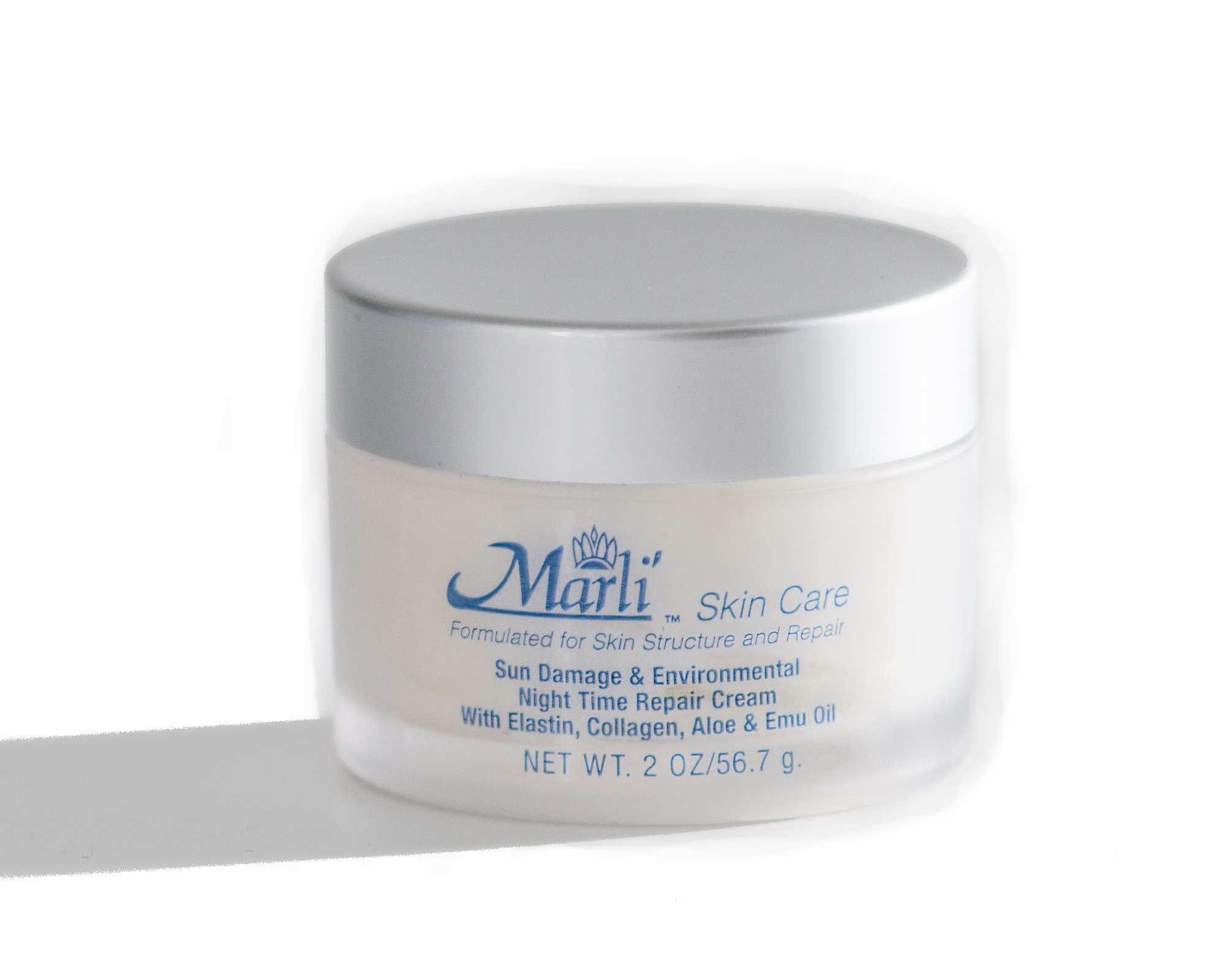 Marli's Sun Damage & Environmental Night Time Repair Cream in a 2 oz jar, showcasing its rich texture and natural ingredients.