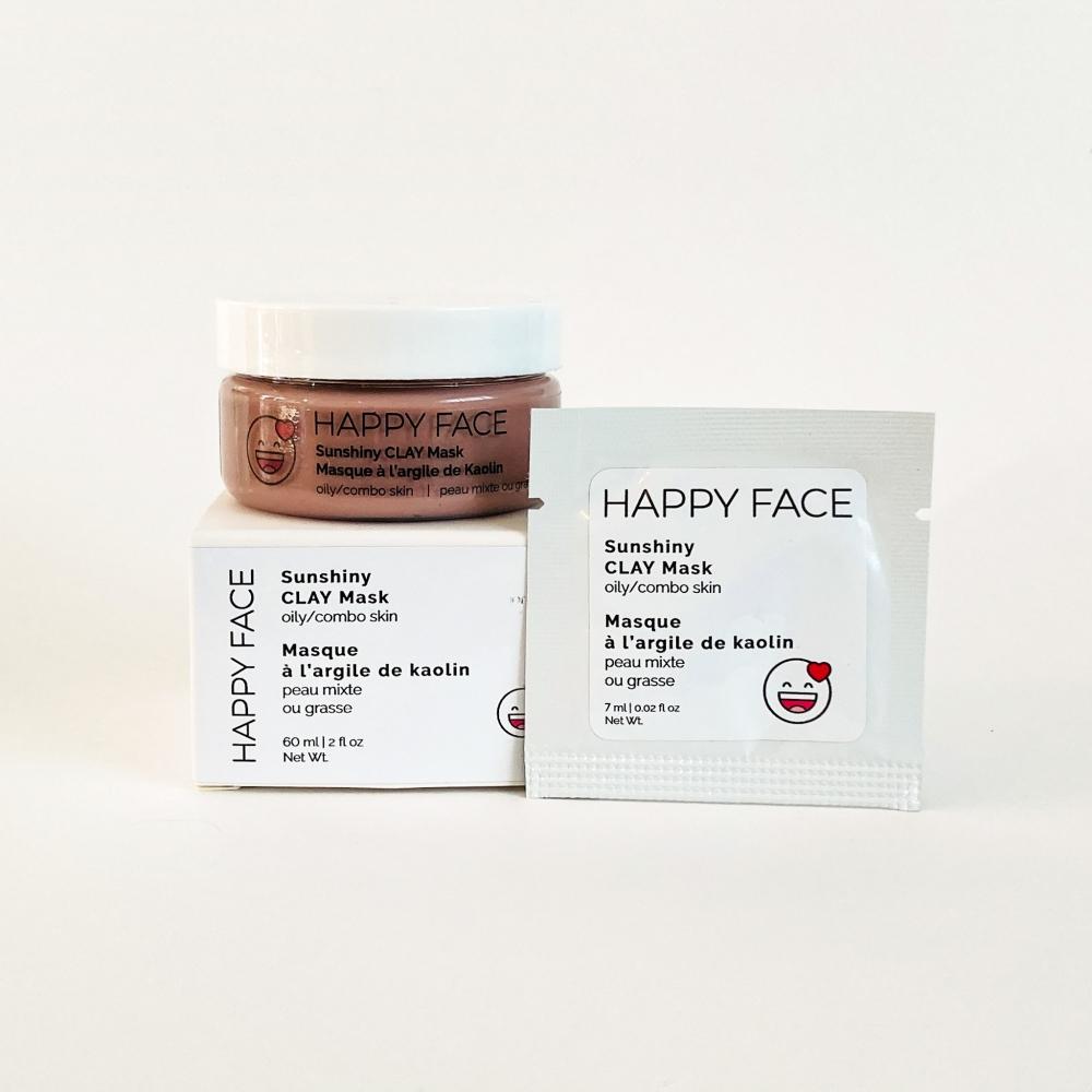 Sunshiny CLAY Mask in a jar with a clay gel texture, surrounded by natural ingredients like spinach and licorice root.