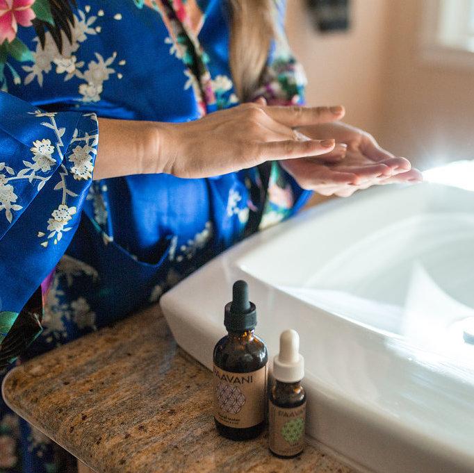 The Vata Skincare Ritual products including cleanser, toner, serum, and floral water, displayed elegantly.