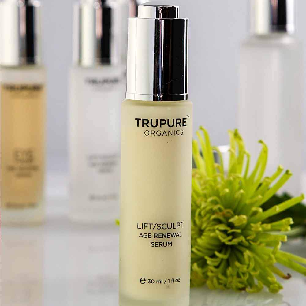 TRUPURE ORGANICS Lift/Sculpt Serum in eco-friendly glass bottle with controlled dropper, showcasing its natural ingredients.