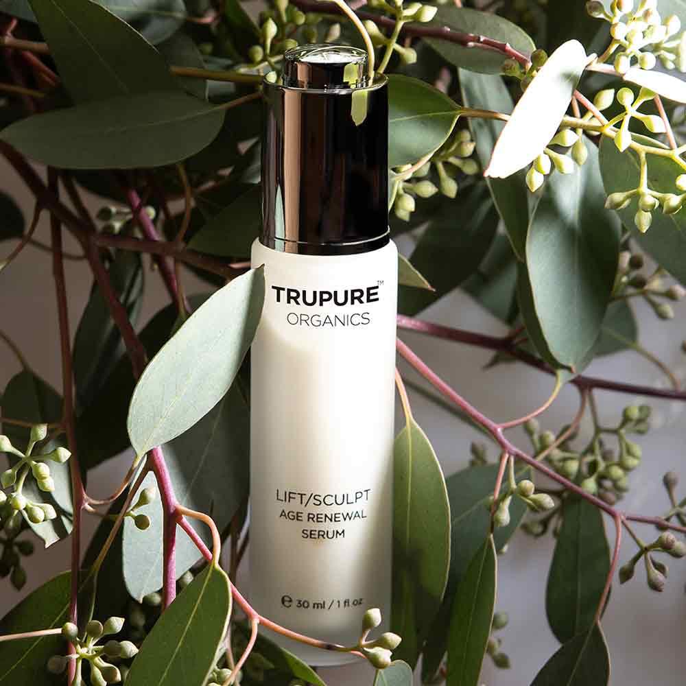 TRUPURE ORGANICS Lift/Sculpt Serum in eco-friendly glass bottle with controlled dropper, showcasing its natural ingredients.