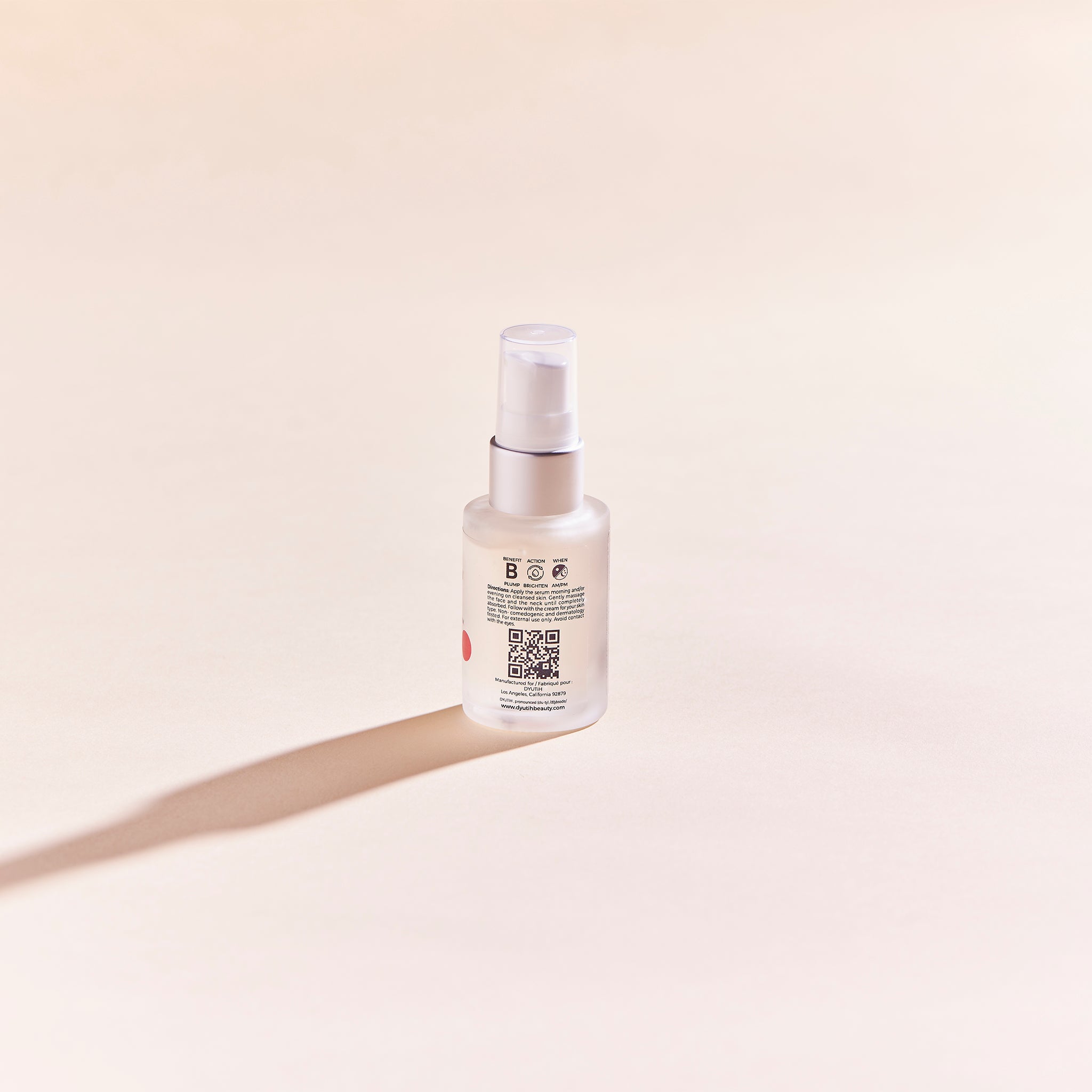 A bottle of ULTRA GLOW BOOSTING Vitamin-C + Lotus Flower Serum with a sleek design, showcasing its brightening and hydrating properties.