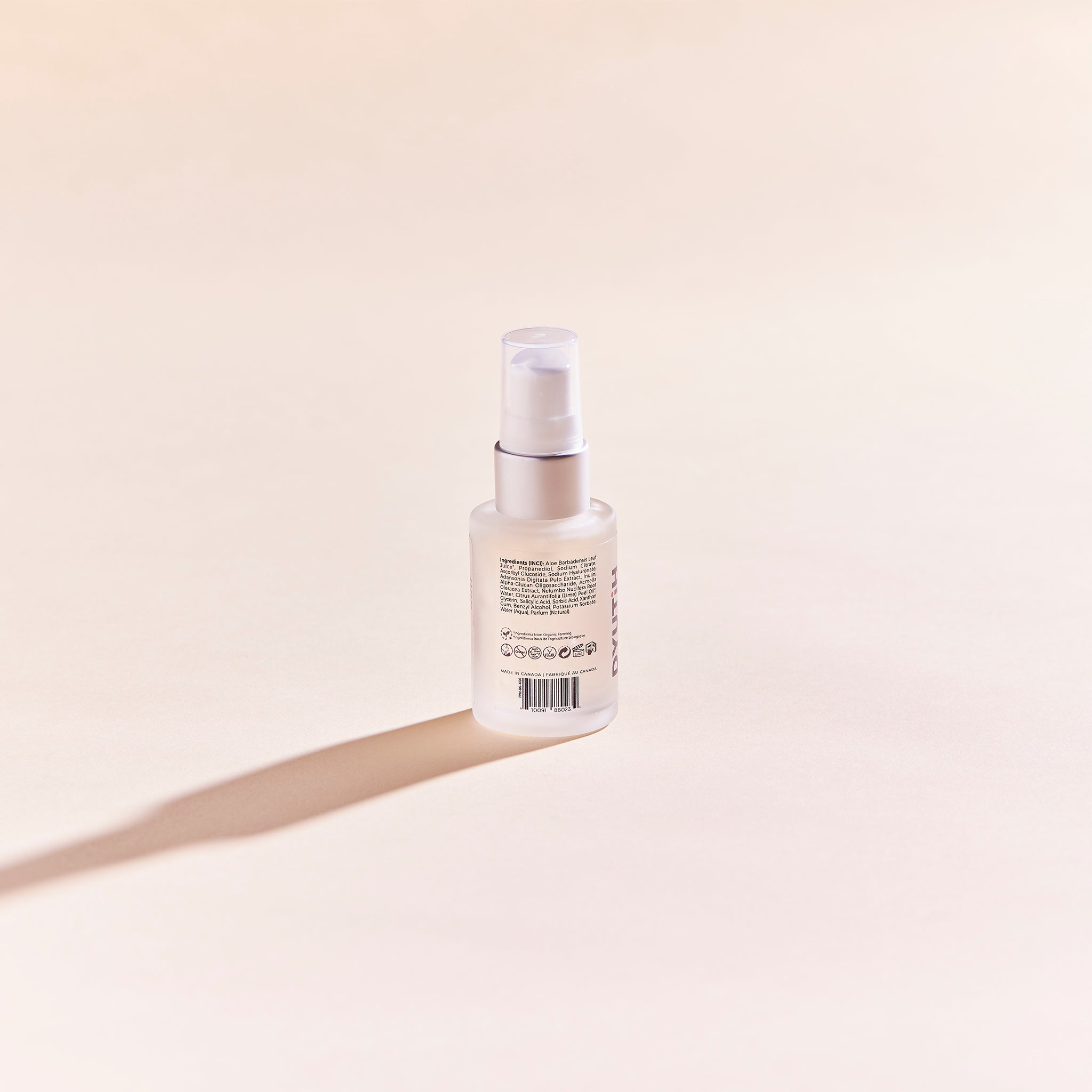 A bottle of ULTRA GLOW BOOSTING Vitamin-C + Lotus Flower Serum with a sleek design, showcasing its brightening and hydrating properties.