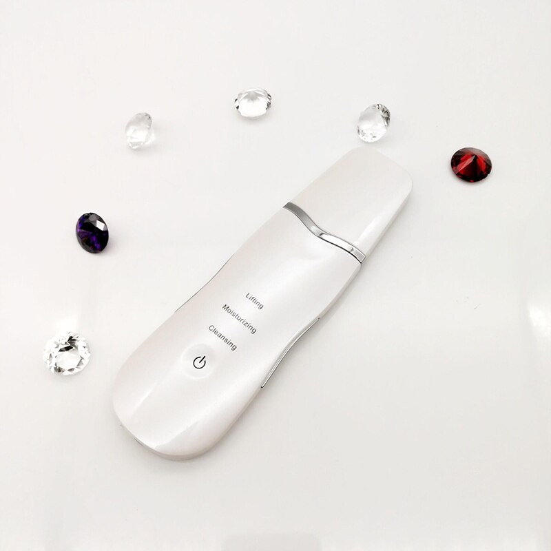 Ultrasonic Skin Scrubber device for deep facial cleansing, featuring a stainless steel scraper and USB charging port.