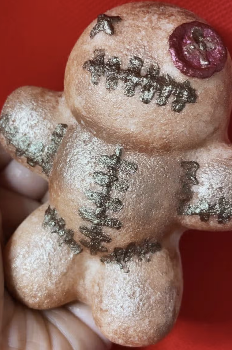 Voodoo doll with button eye