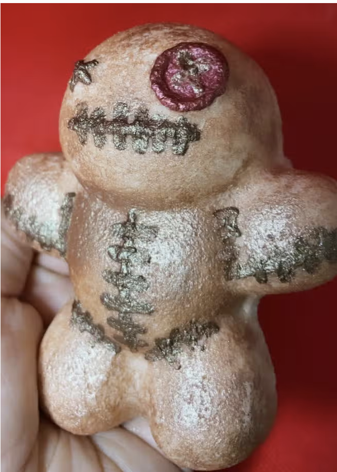 Handmade voodoo doll cookie.