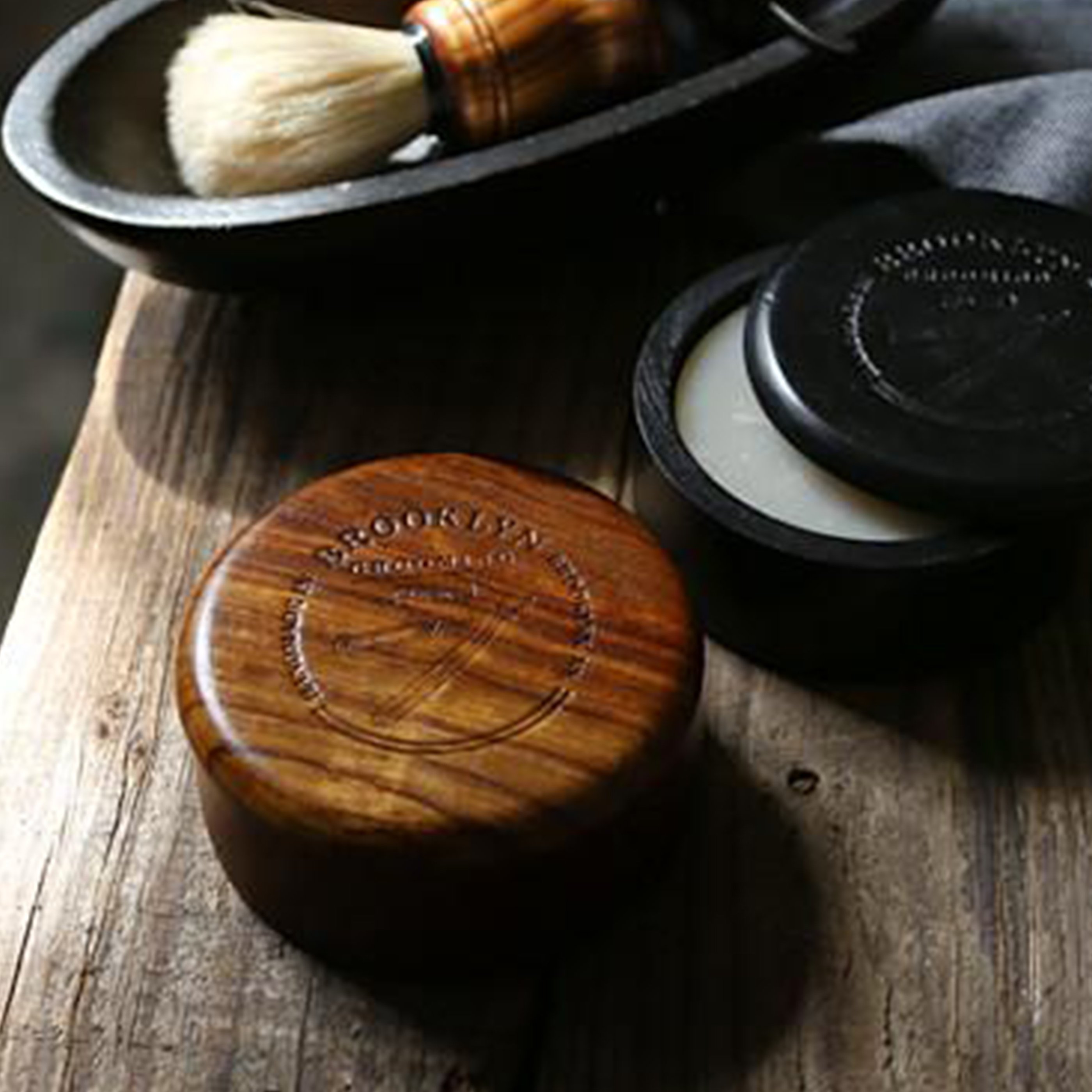 Handmade Dark Oak Wood Shaving Bowl with polished finish and logo stamp, showcasing its unique craftsmanship.