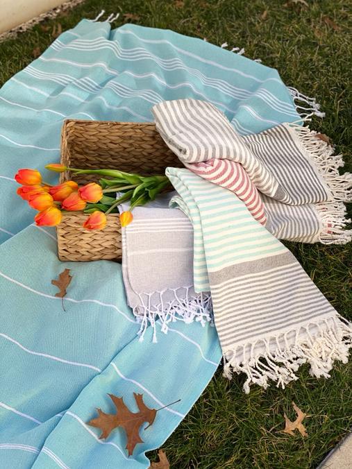 A colorful assortment of 5 random Turkish peshtemals, showcasing various patterns and colors, perfect for beach or home use.