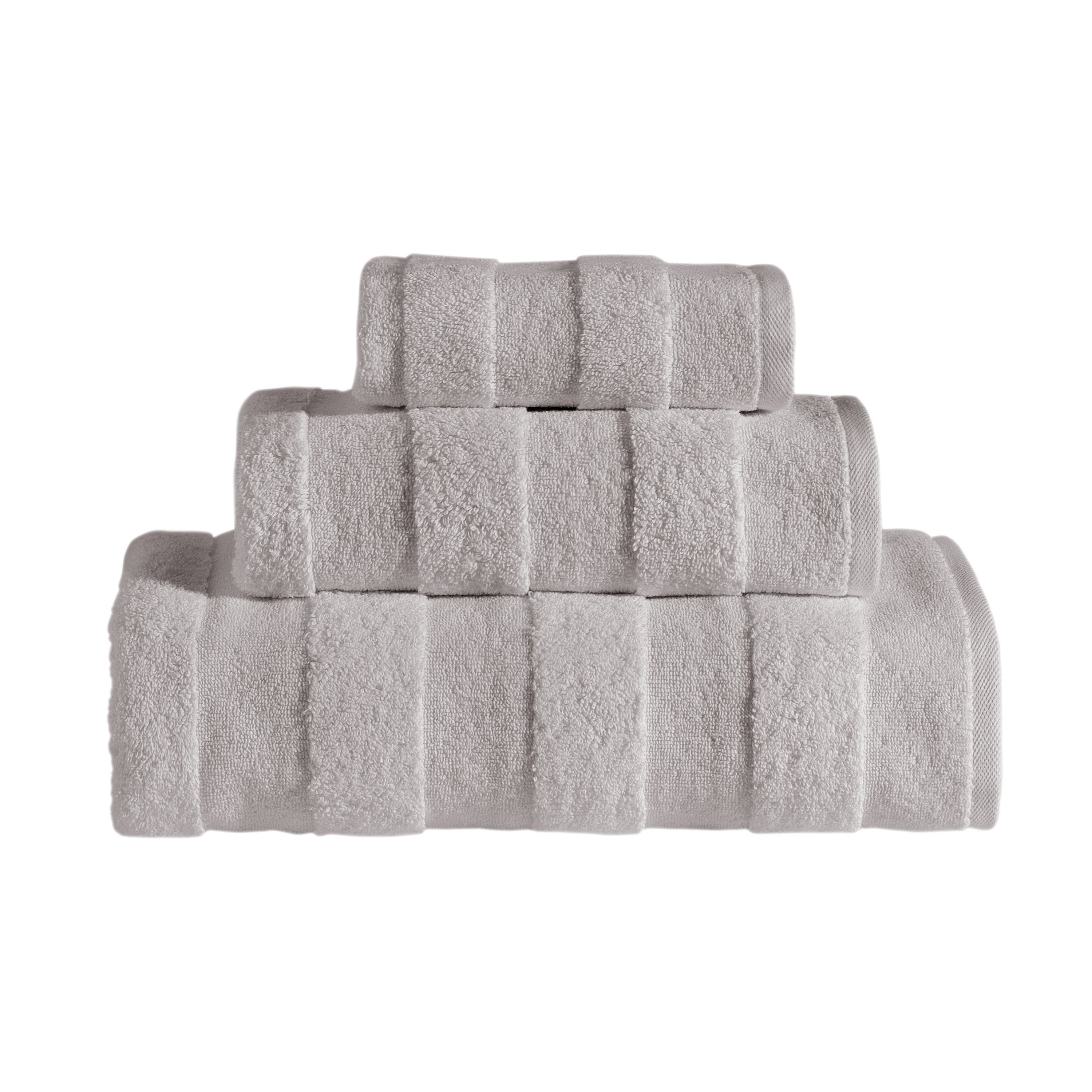 Apogee Collection Luxury Towels showcasing elegant textures and soft cotton fabric in various sizes.