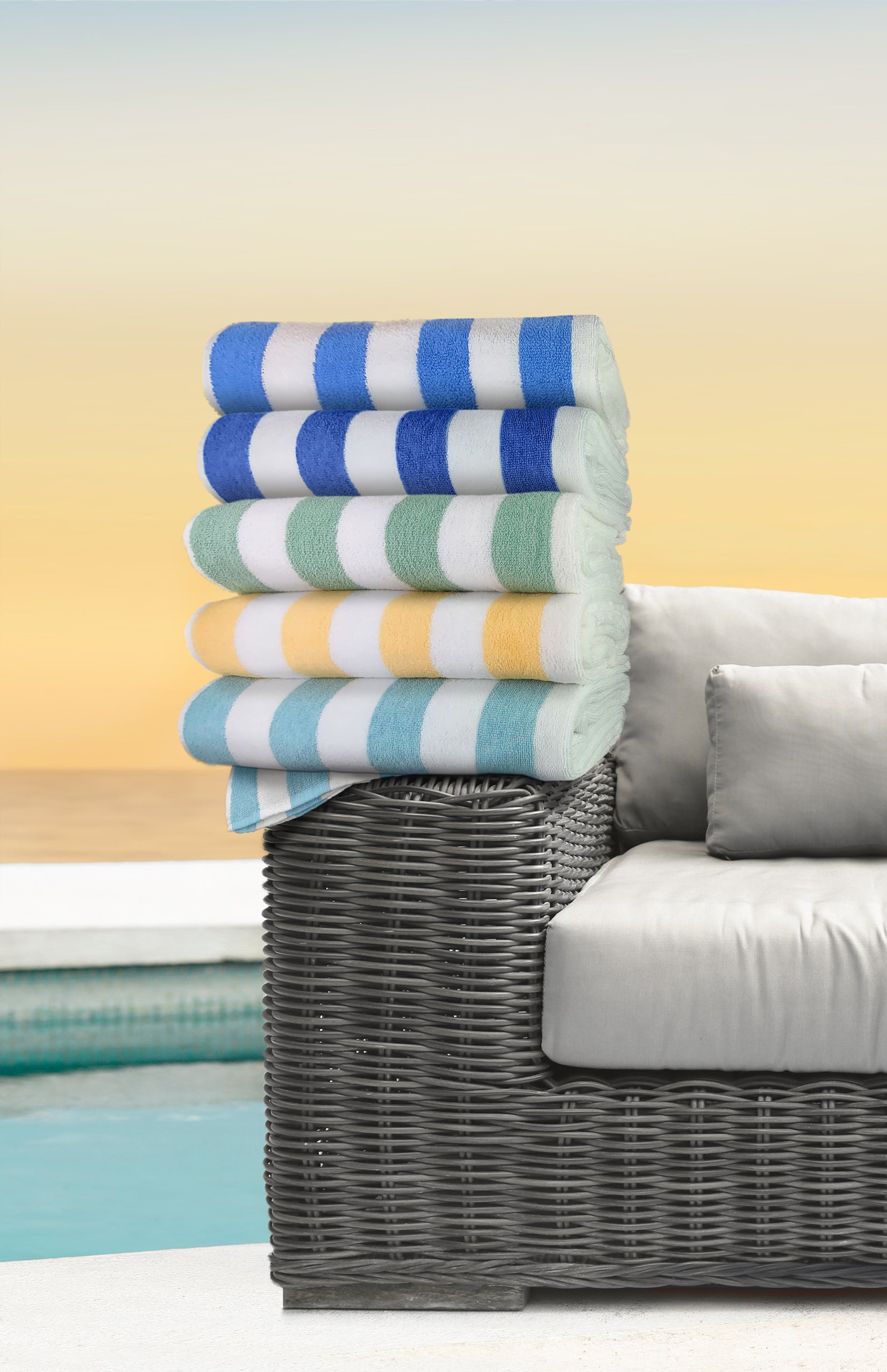 Two vibrant Cabana Stripes Pool/Beach Towels featuring durable cotton-polyester blend with colorful stripes.