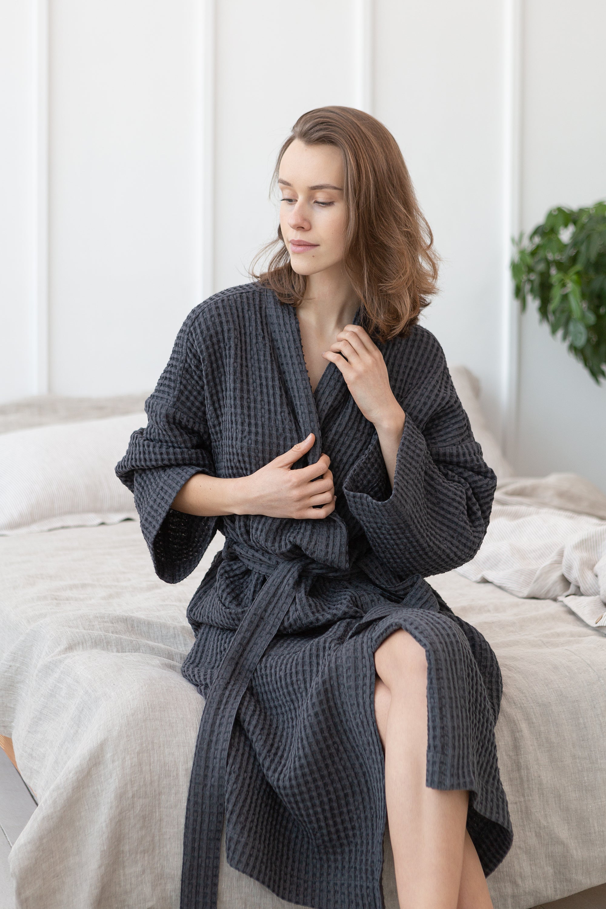 A luxurious grey linen waffle robe displayed elegantly, showcasing its soft texture and stylish design, perfect for relaxation and comfort.