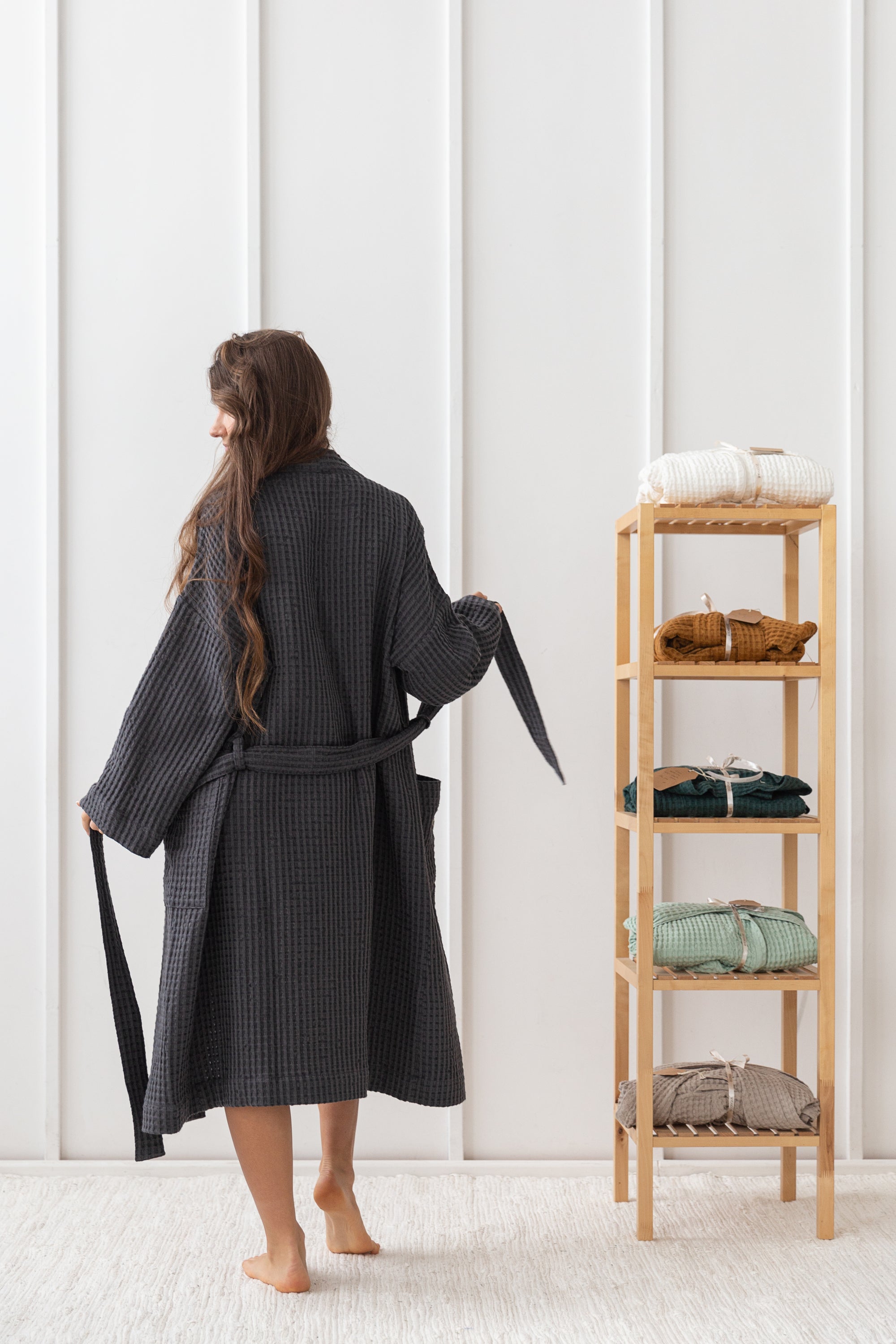 A luxurious grey linen waffle robe displayed elegantly, showcasing its soft texture and stylish design, perfect for relaxation and comfort.