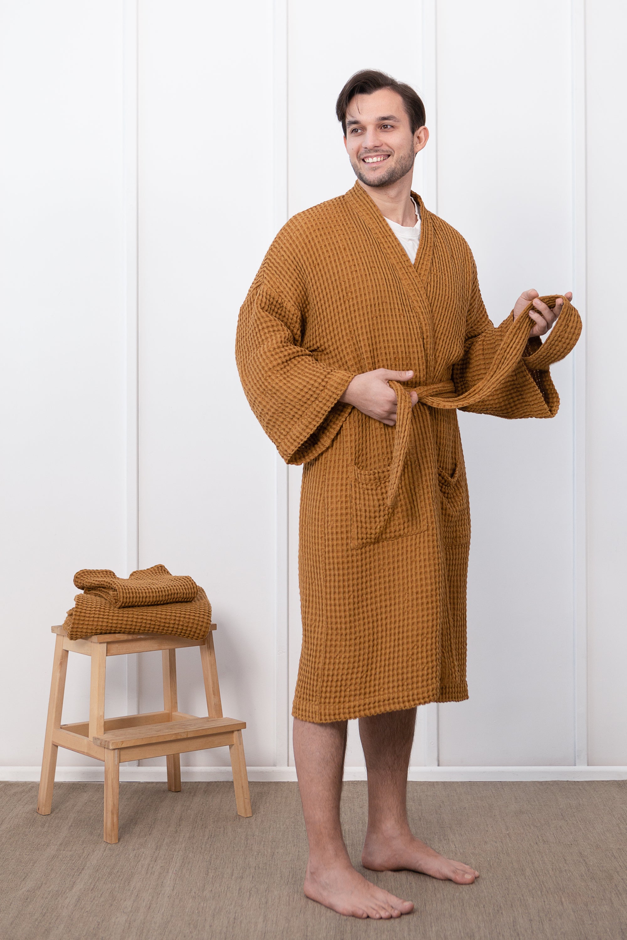 A luxurious grey linen waffle robe displayed elegantly, showcasing its soft texture and stylish design, perfect for relaxation and comfort.