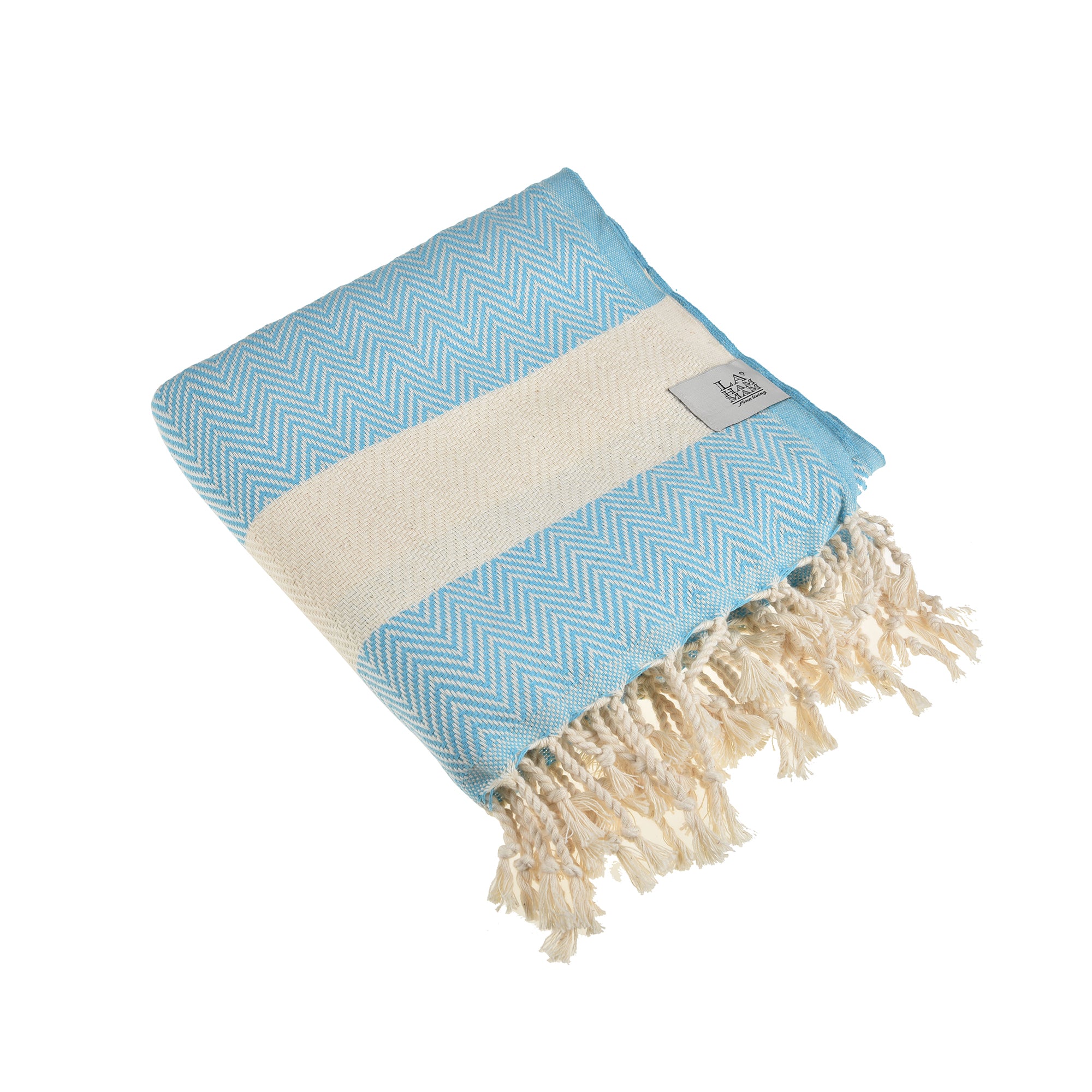 Herring Beach Towel in vibrant colors, showcasing its soft cotton texture and large size, ideal for beach and outdoor use.