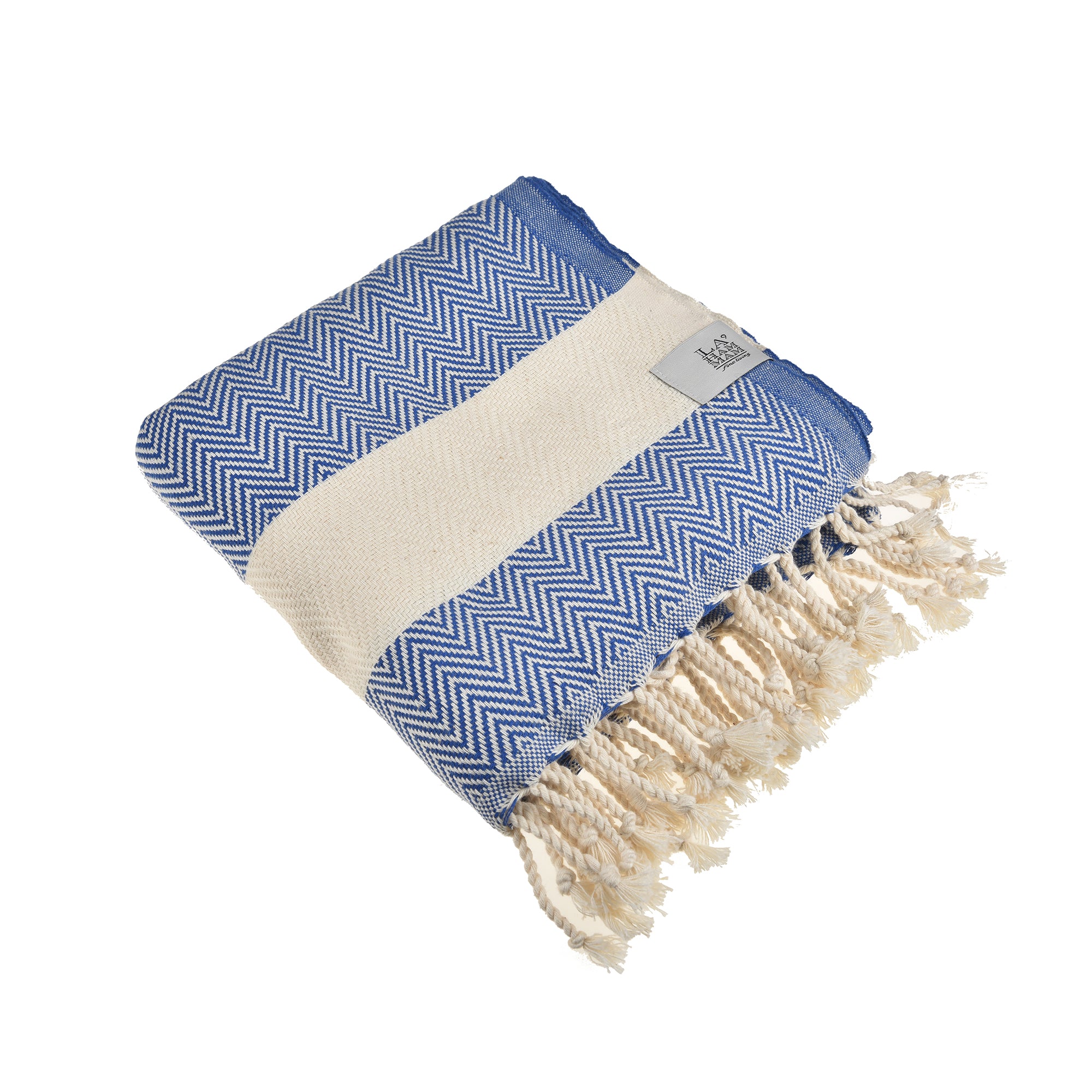 Herring Beach Towel in vibrant colors, showcasing its soft cotton texture and large size, ideal for beach and outdoor use.