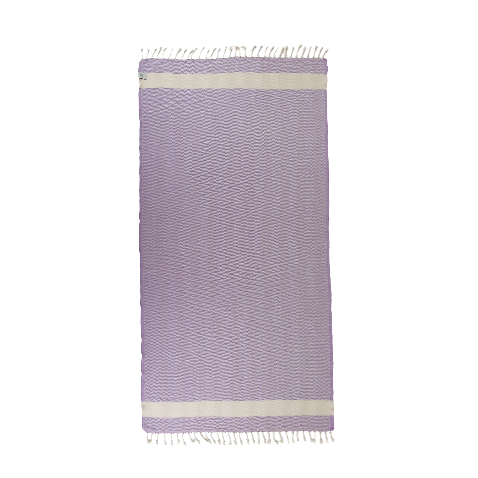 Herring Beach Towel in vibrant colors, showcasing its soft cotton texture and large size, ideal for beach and outdoor use.