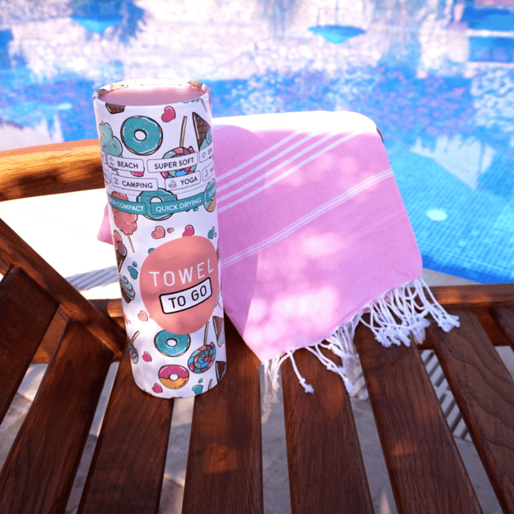 Ipanema Hammam Turkish Towel in pink, beautifully packaged in a recycled gift box, showcasing its soft cotton texture.