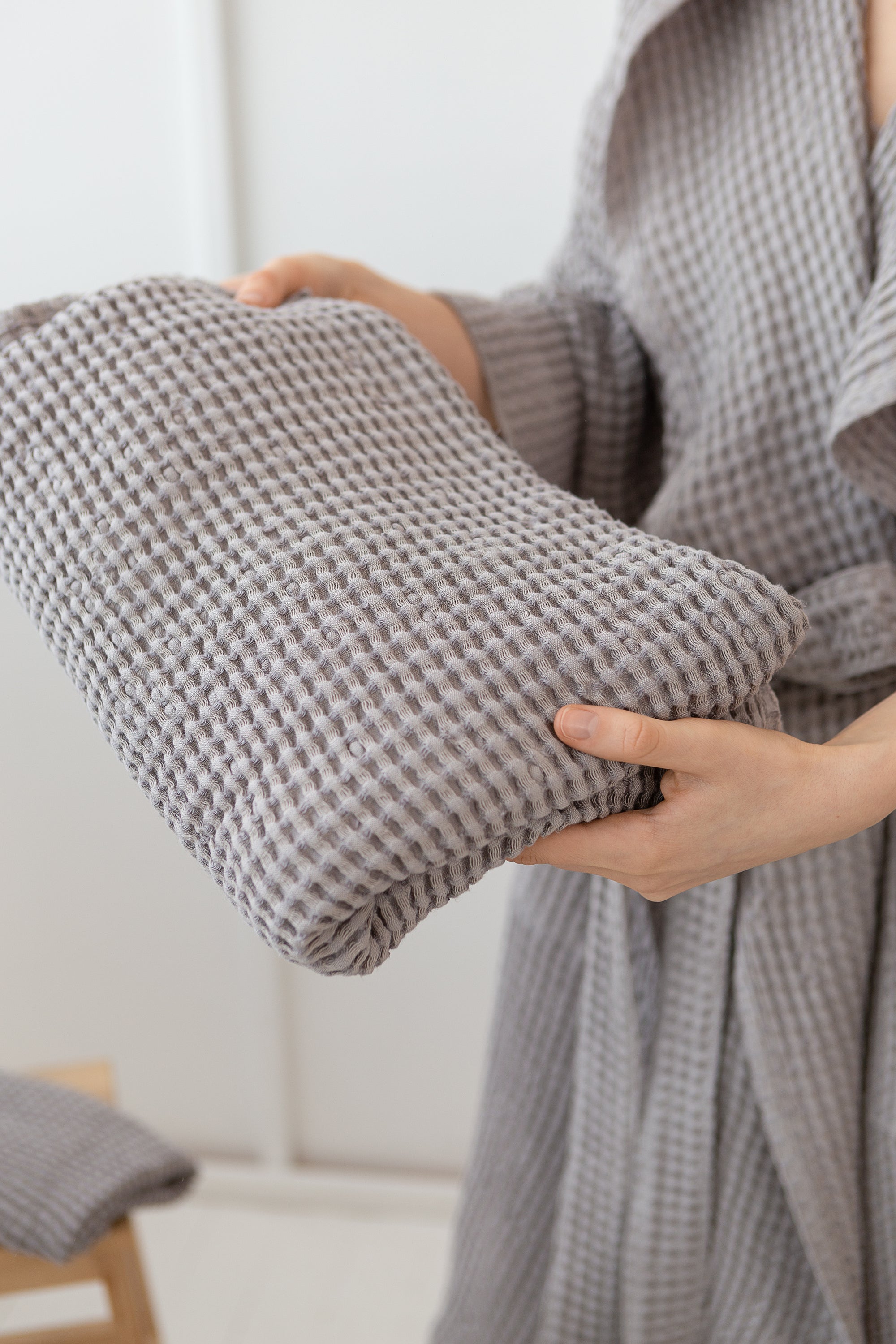 Light Grey linen waffle towel showcasing its unique texture and soft fabric, perfect for luxurious bathing experiences.