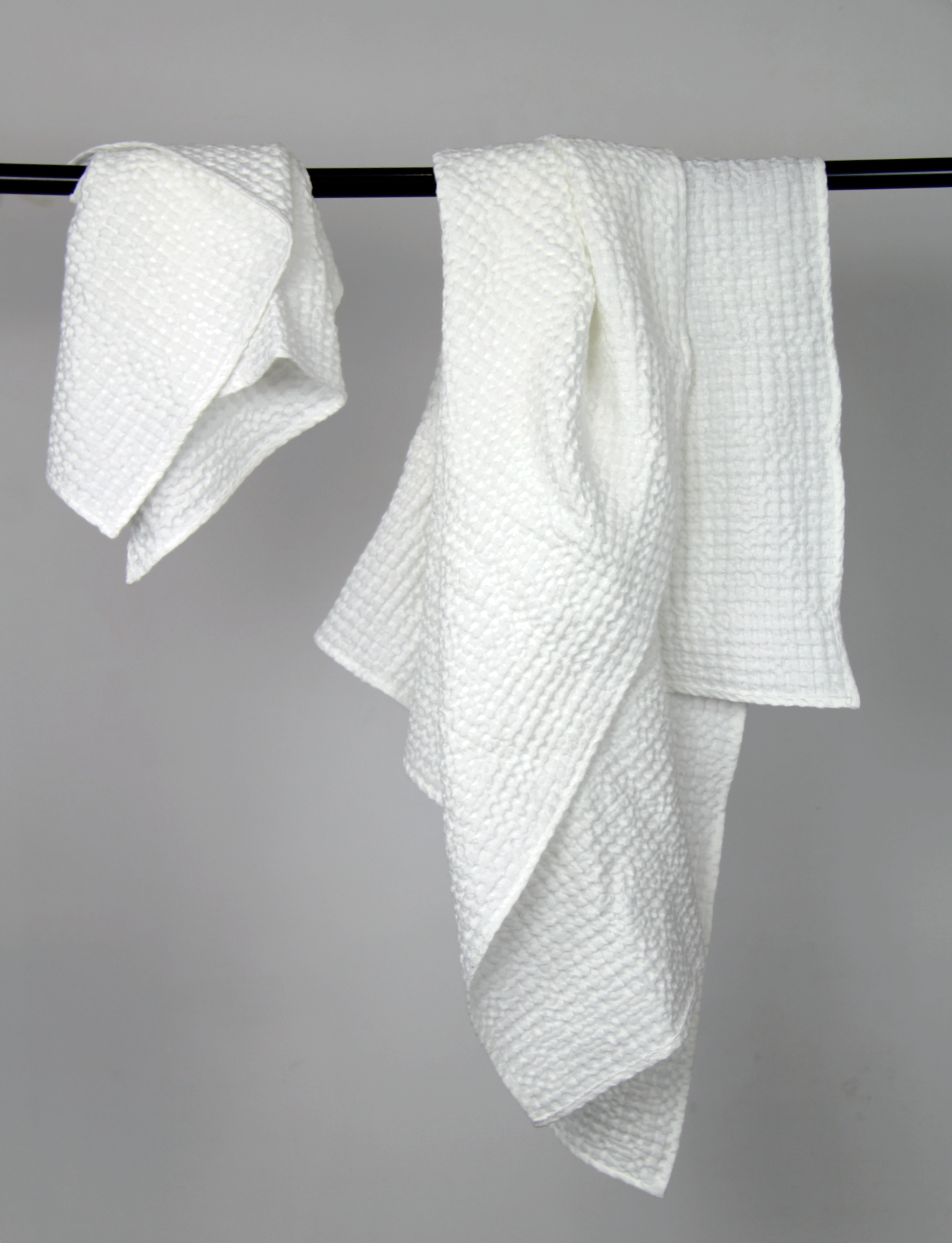 Light Grey linen waffle towel showcasing its unique texture and soft fabric, perfect for luxurious bathing experiences.