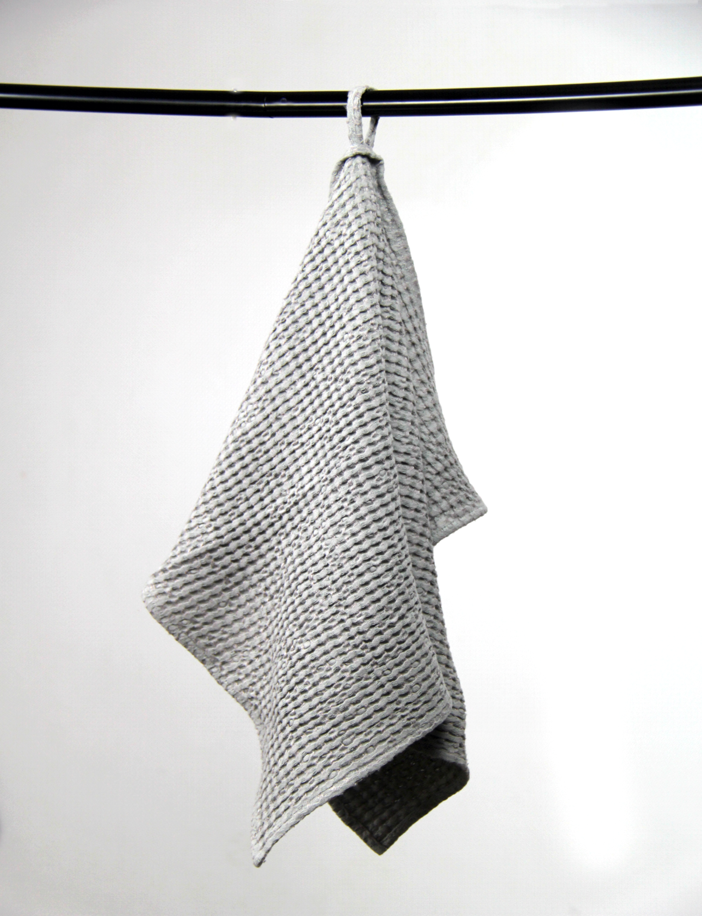 Light Grey linen waffle towel showcasing its unique texture and soft fabric, perfect for luxurious bathing experiences.