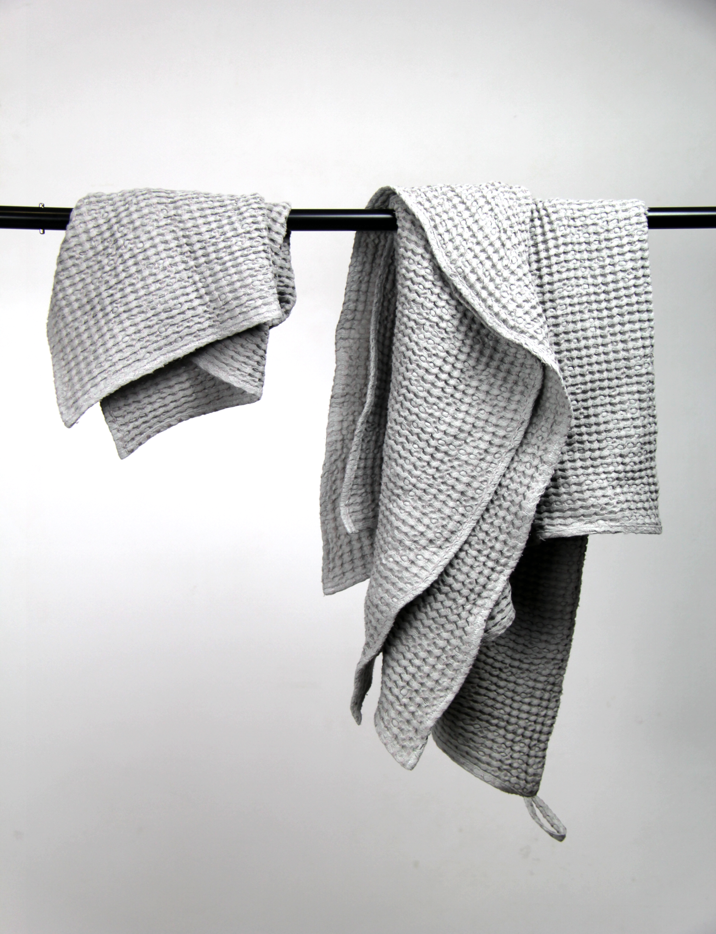 Light Grey linen waffle towel showcasing its unique texture and soft fabric, perfect for luxurious bathing experiences.