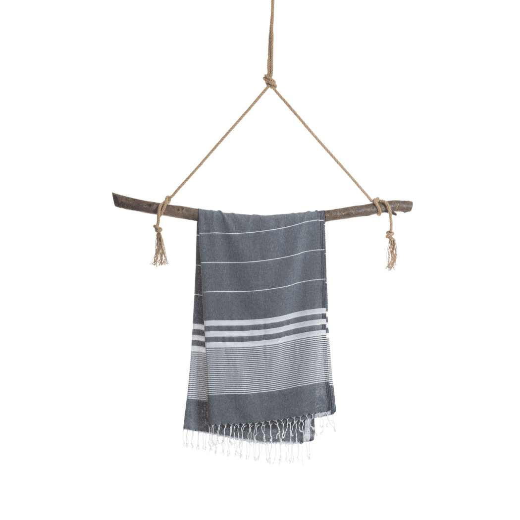 Malibu Hammam Towel in black, made from 100% cotton, displayed in a recycled gift box, showcasing its stylish and eco-friendly design.