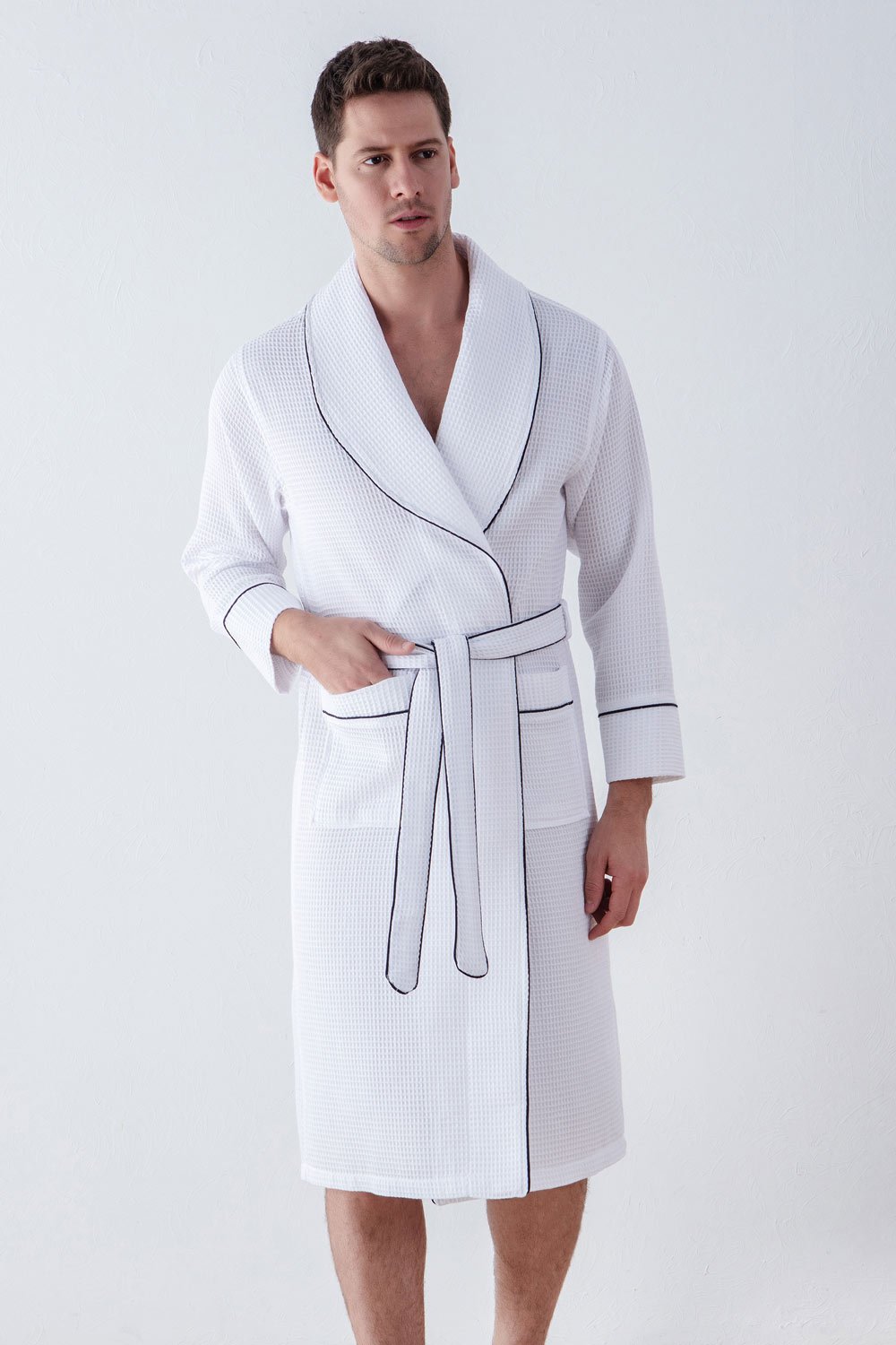 Men's Luxury Waffle Hotel Robe in various colors, showcasing its soft texture and stylish design with shawl collar and pockets.