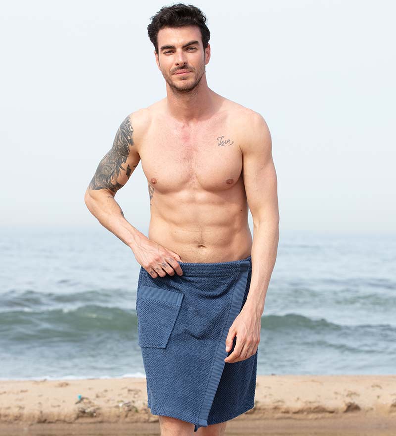 Men's Turkish Cotton Towel Wrap in various colors, showcasing its adjustable velcro closure and pocket feature.