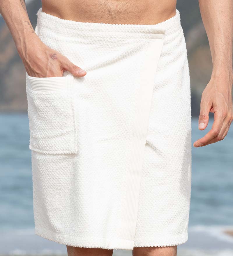 Men's Turkish Cotton Towel Wrap in various colors, showcasing its adjustable velcro closure and pocket feature.