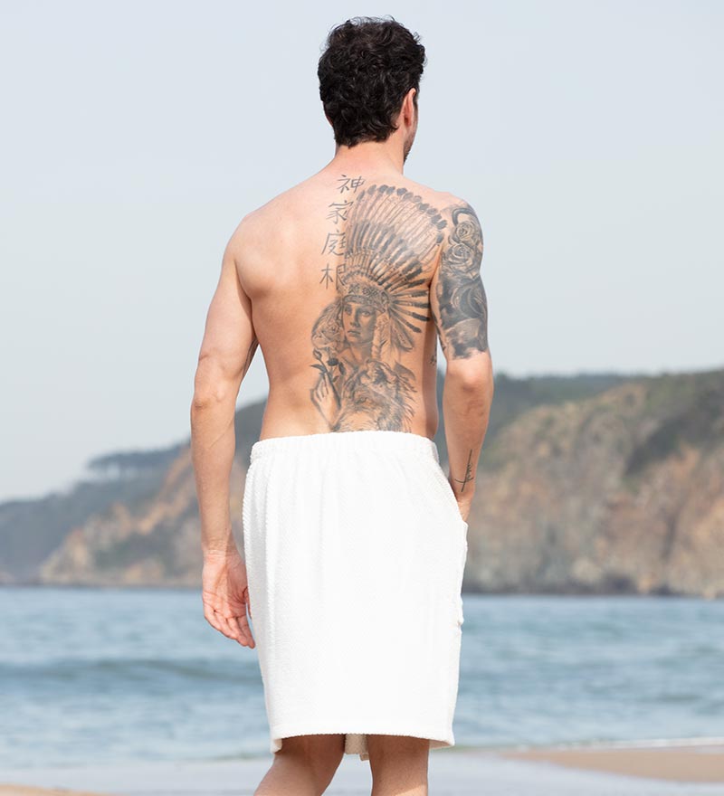 Men's Turkish Cotton Towel Wrap in various colors, showcasing its adjustable velcro closure and pocket feature.