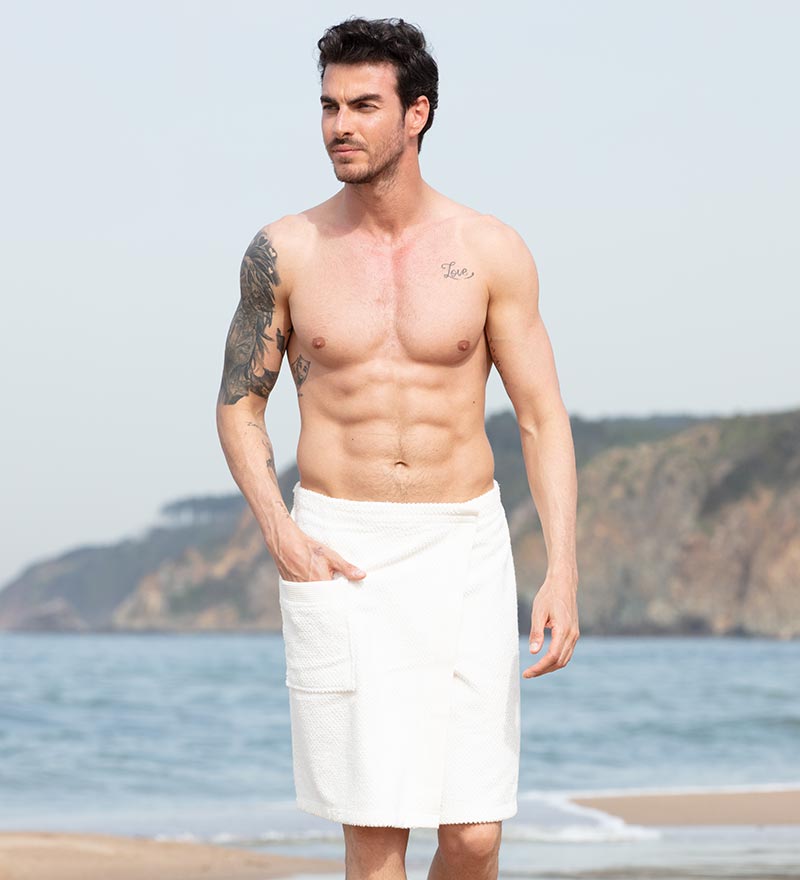 Men's Turkish Cotton Towel Wrap in various colors, showcasing its adjustable velcro closure and pocket feature.