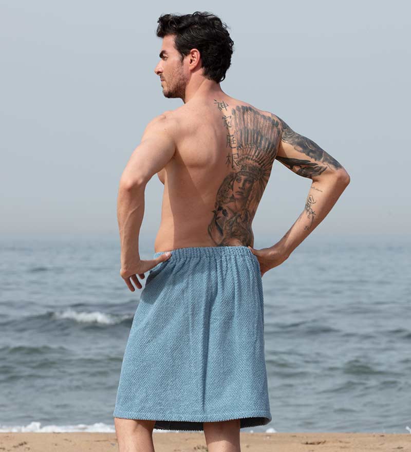 Men's Turkish Cotton Towel Wrap in various colors, showcasing its adjustable velcro closure and pocket feature.