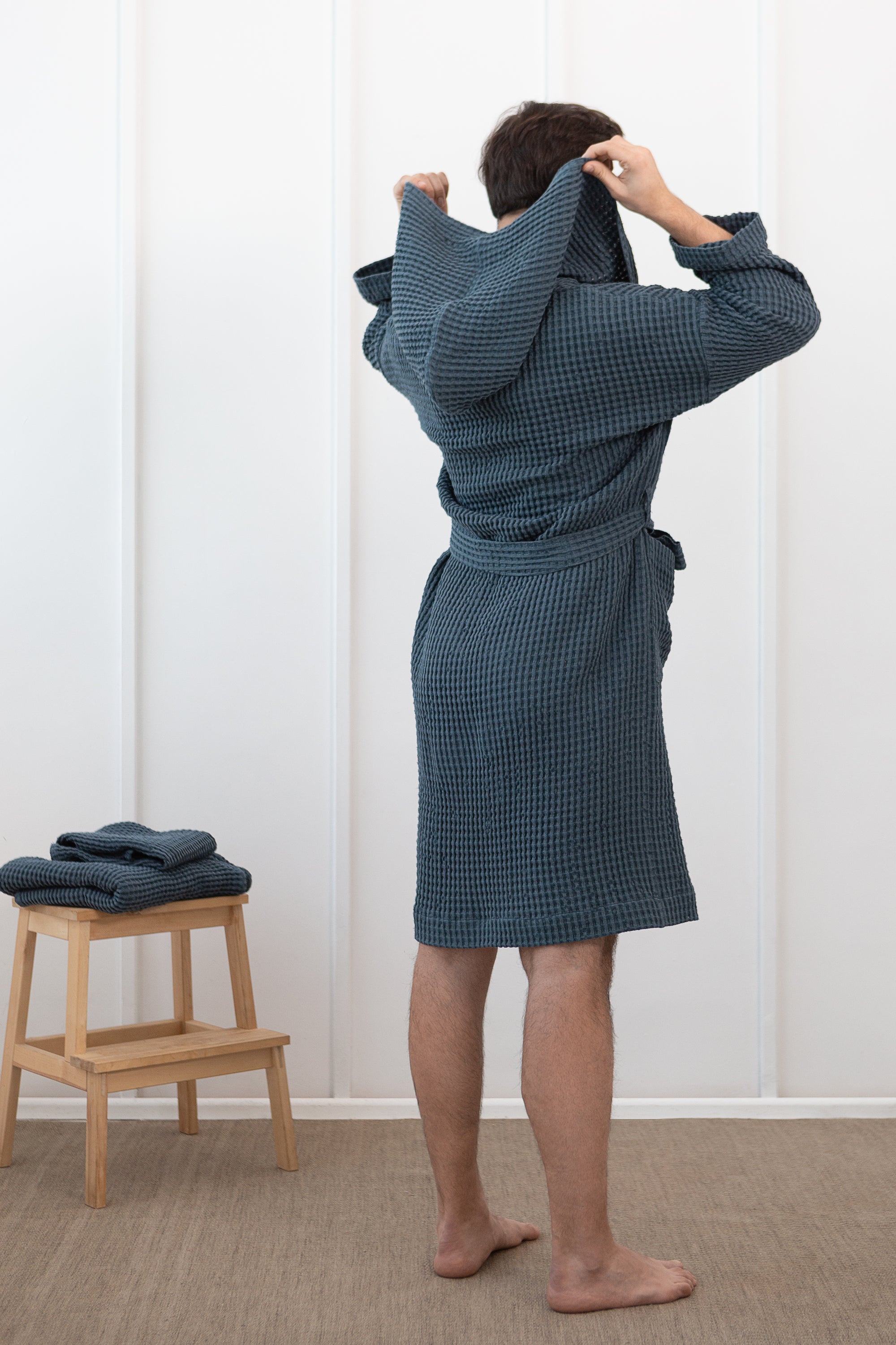 Navy Blue linen waffle robe with a cozy hoodie, showcasing its soft texture and stylish design, perfect for relaxation.