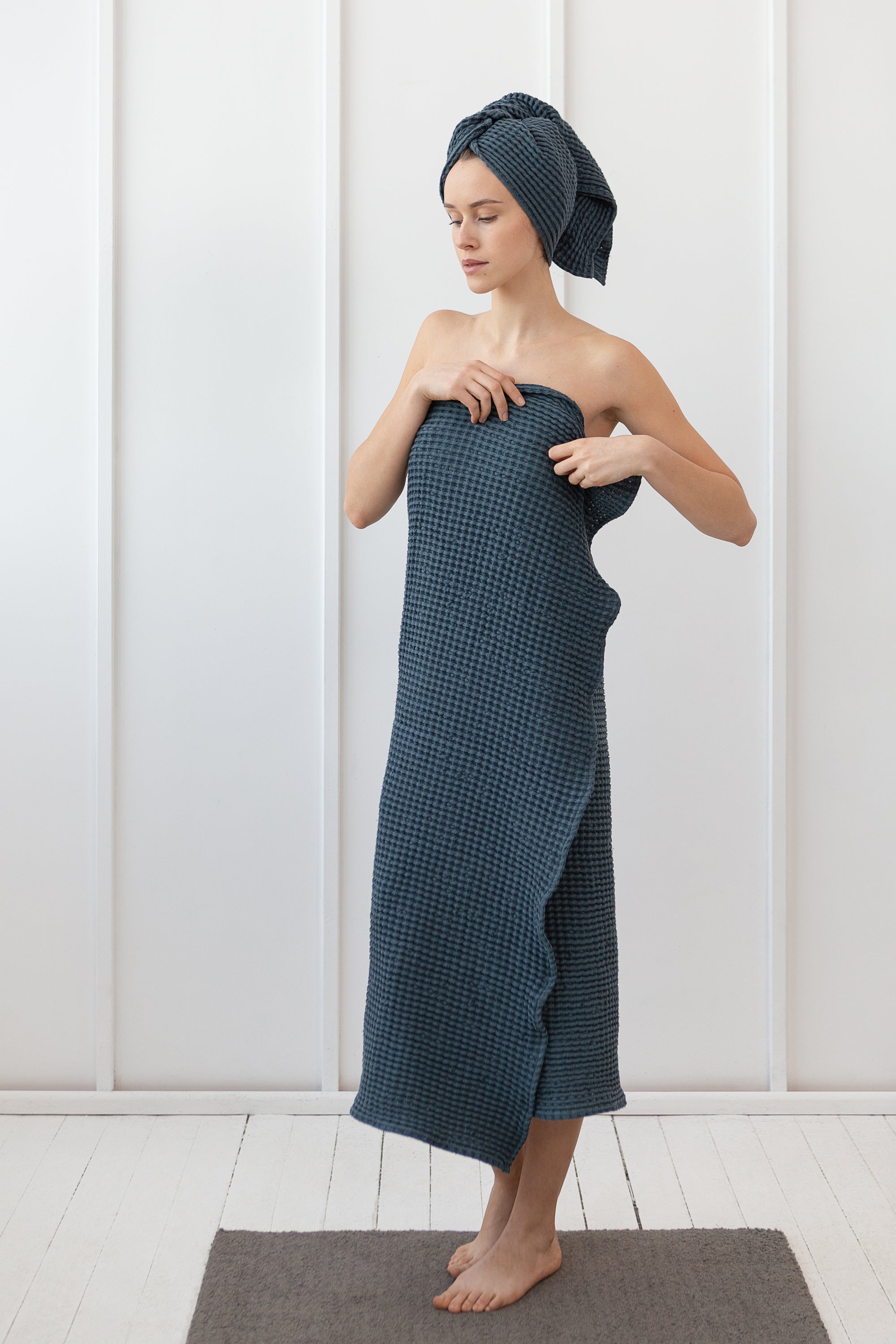 Luxurious navy blue linen waffle towel with a unique texture, showcasing its softness and absorbency.