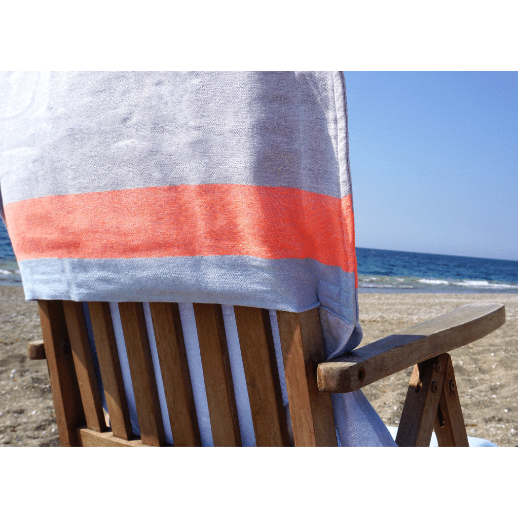 Neon Two-in-One Beach Towel and Bag in blue and grey, made from recycled cotton, showcasing its stylish design and functionality.