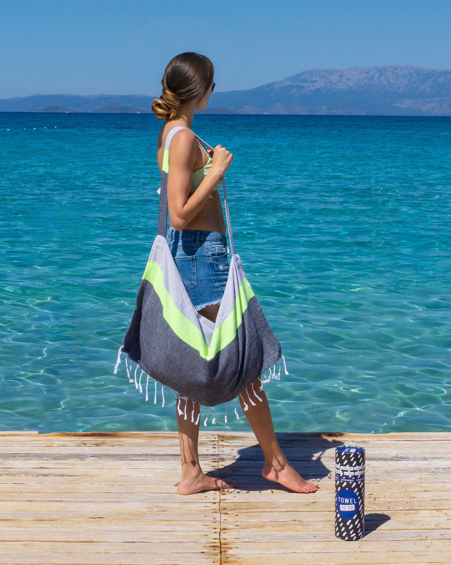 Neon Two-in-One Beach Towel and Bag in grey and black, made from recycled cotton, showcasing its stylish design and vibrant neon stripe.