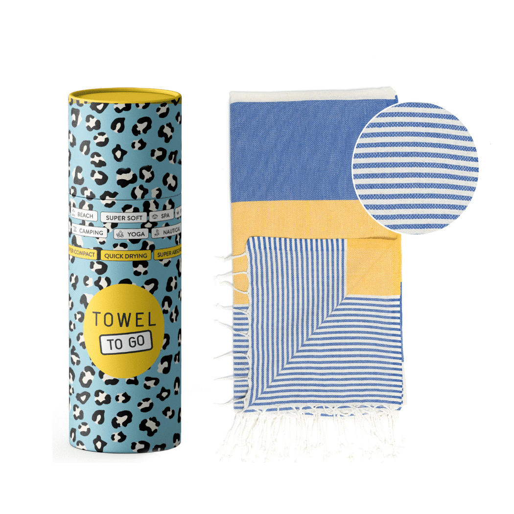 Palermo Beach Towel featuring vibrant blue and yellow stripes, handwoven from 100% cotton, displayed in a recycled gift box.