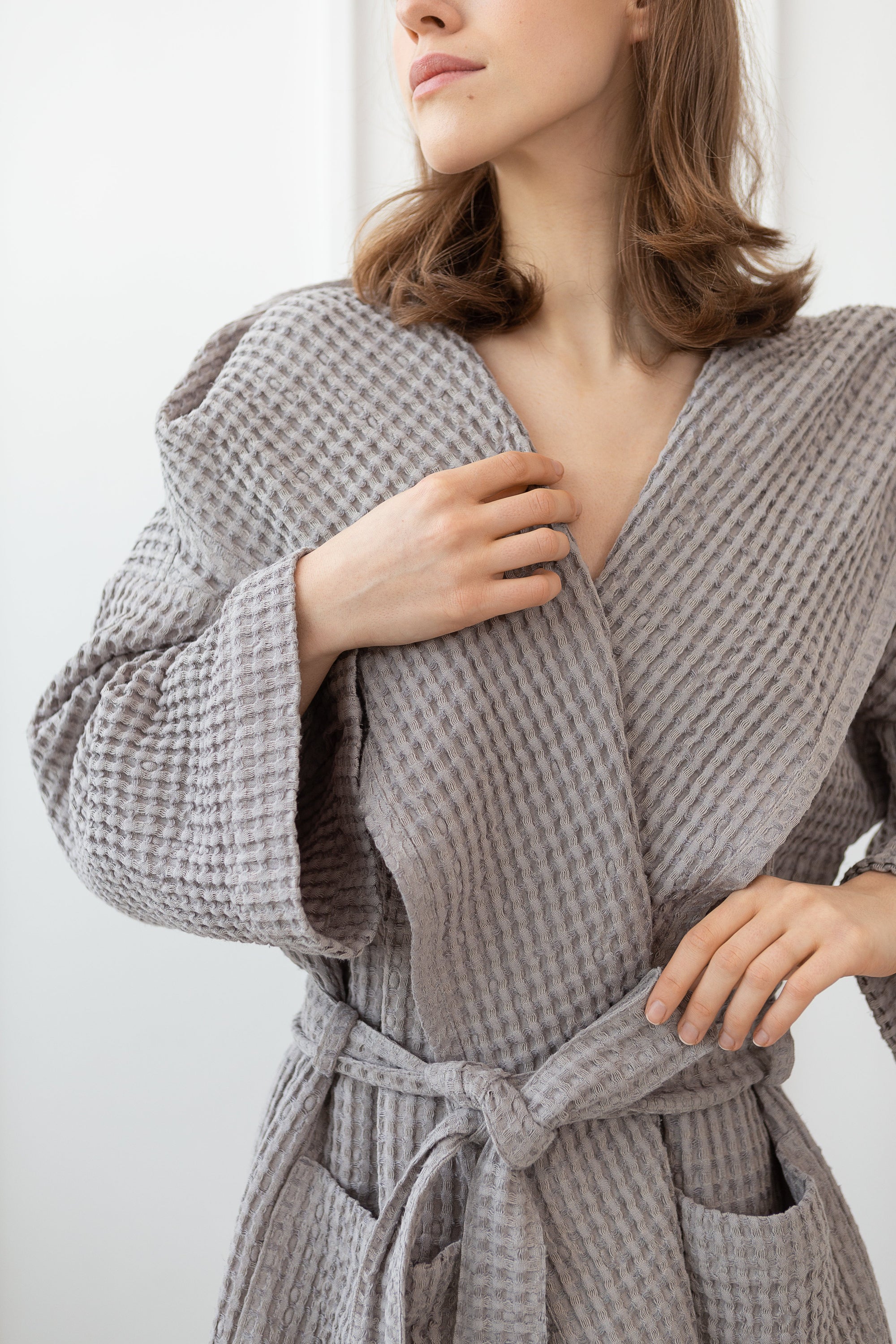 Plum linen waffle robe with a cozy hoodie, featuring a soft texture and two front pockets, perfect for relaxation.