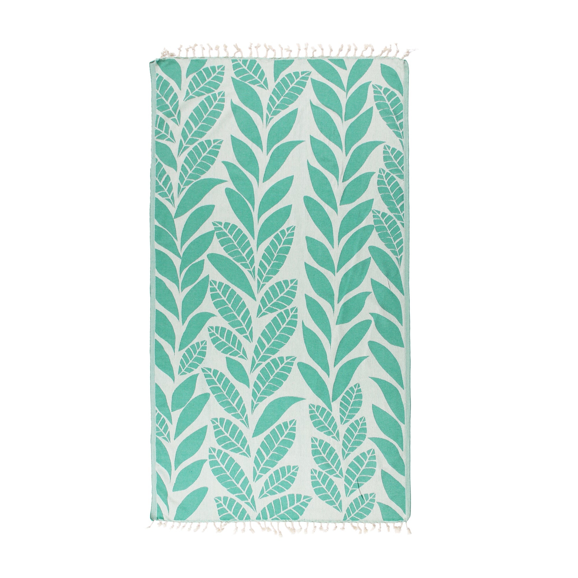 A vibrant Seaweed Pure Cotton Throw Beach Towel displayed on a sandy beach, showcasing its soft texture and traditional woven design.