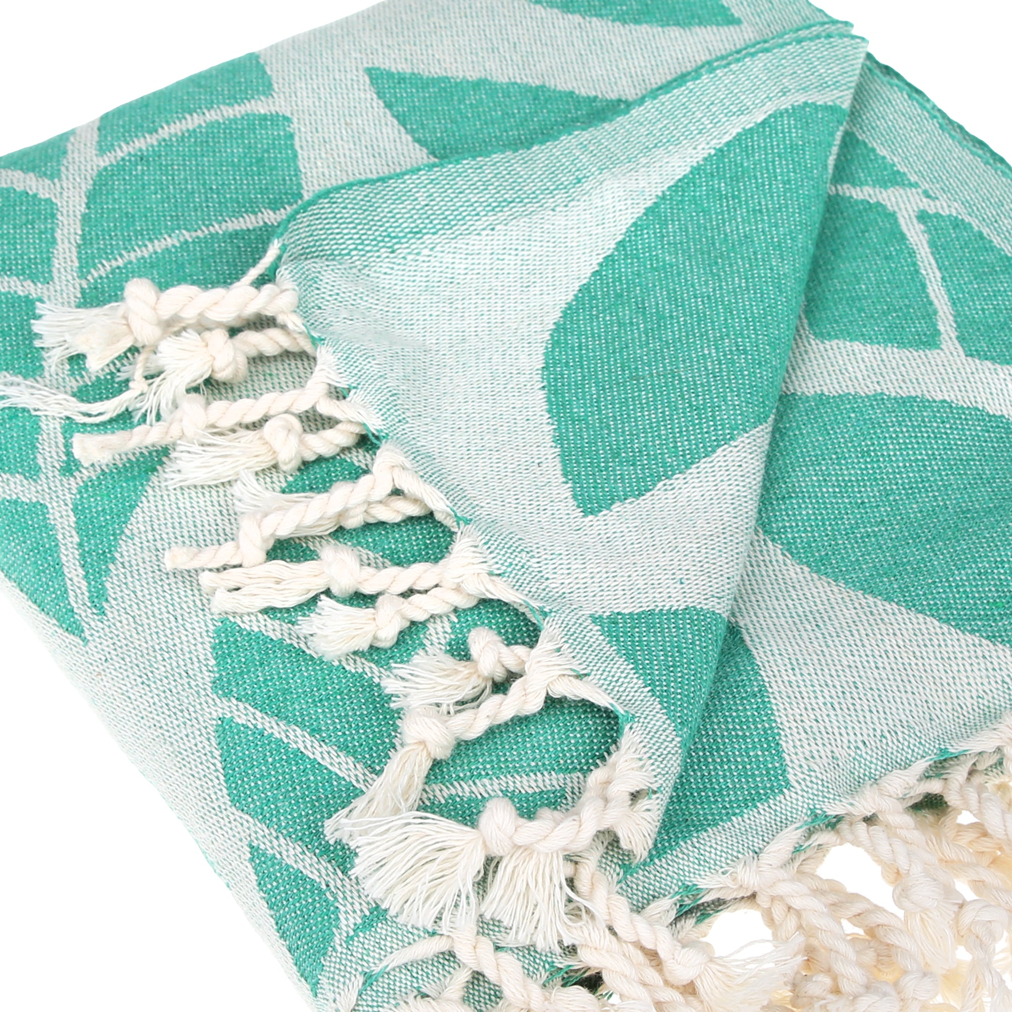 A vibrant Seaweed Pure Cotton Throw Beach Towel displayed on a sandy beach, showcasing its soft texture and traditional woven design.