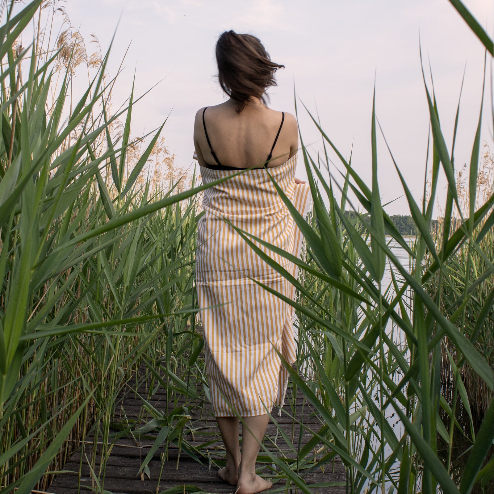 Soni Turkish Towel featuring a classic black striped design, made of 100% organic cotton, perfect for beach and spa use.