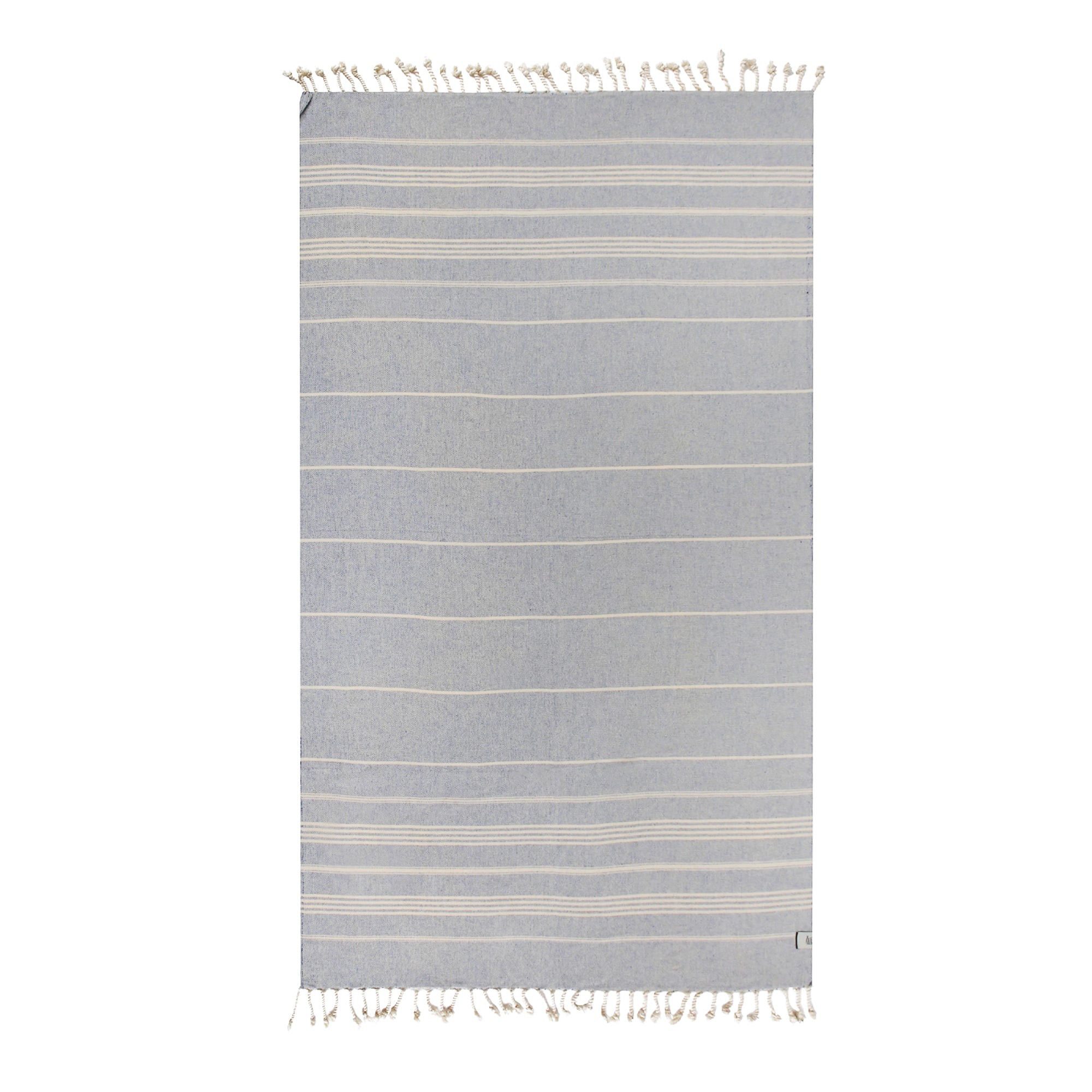 Sultan Beach Towel displayed in vibrant colors, showcasing its traditional woven style and ultra-soft texture, perfect for beach and picnic use.