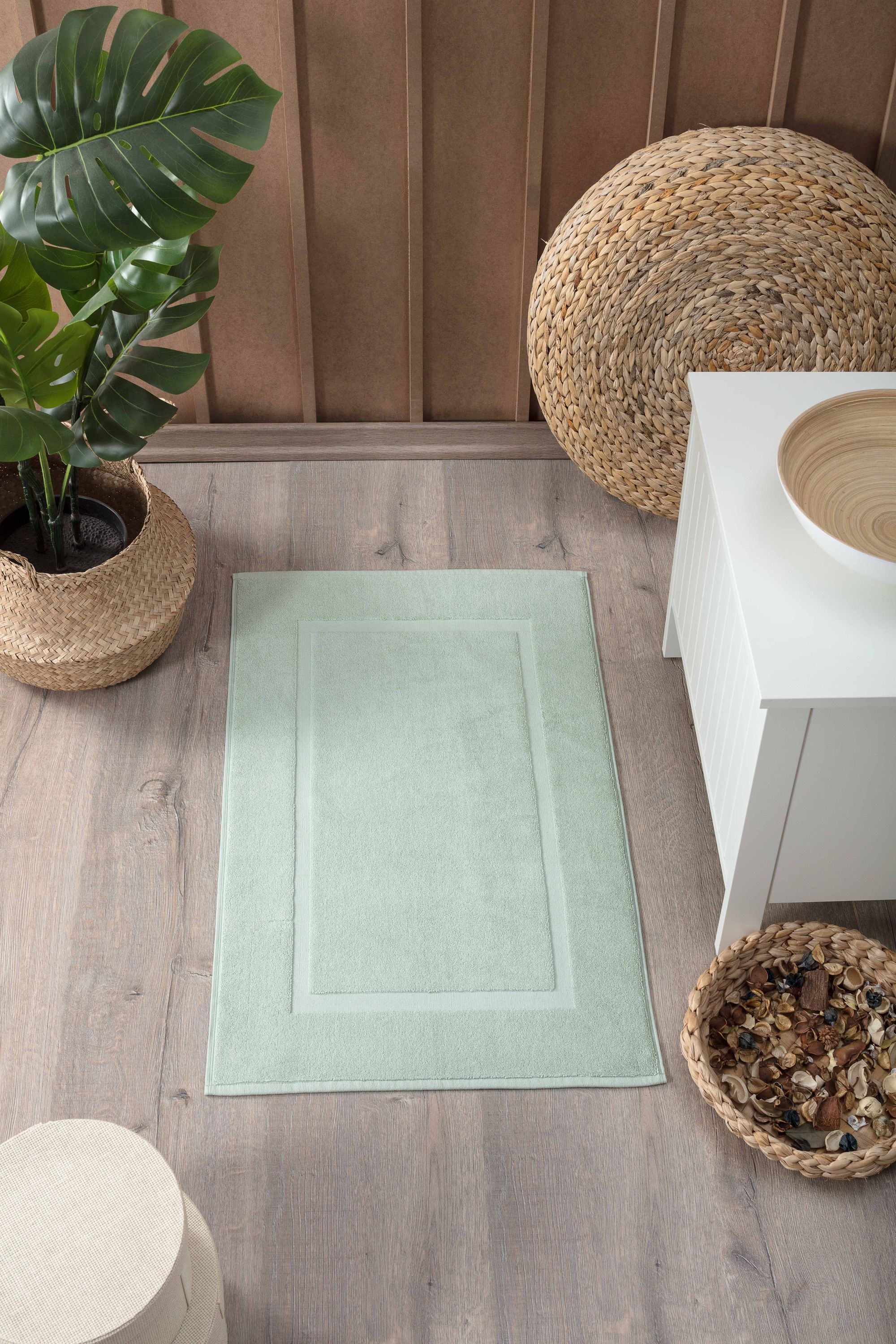 Two luxurious Turkish cotton bath mats in a stylish design, showcasing their plush texture and dobby weave border.