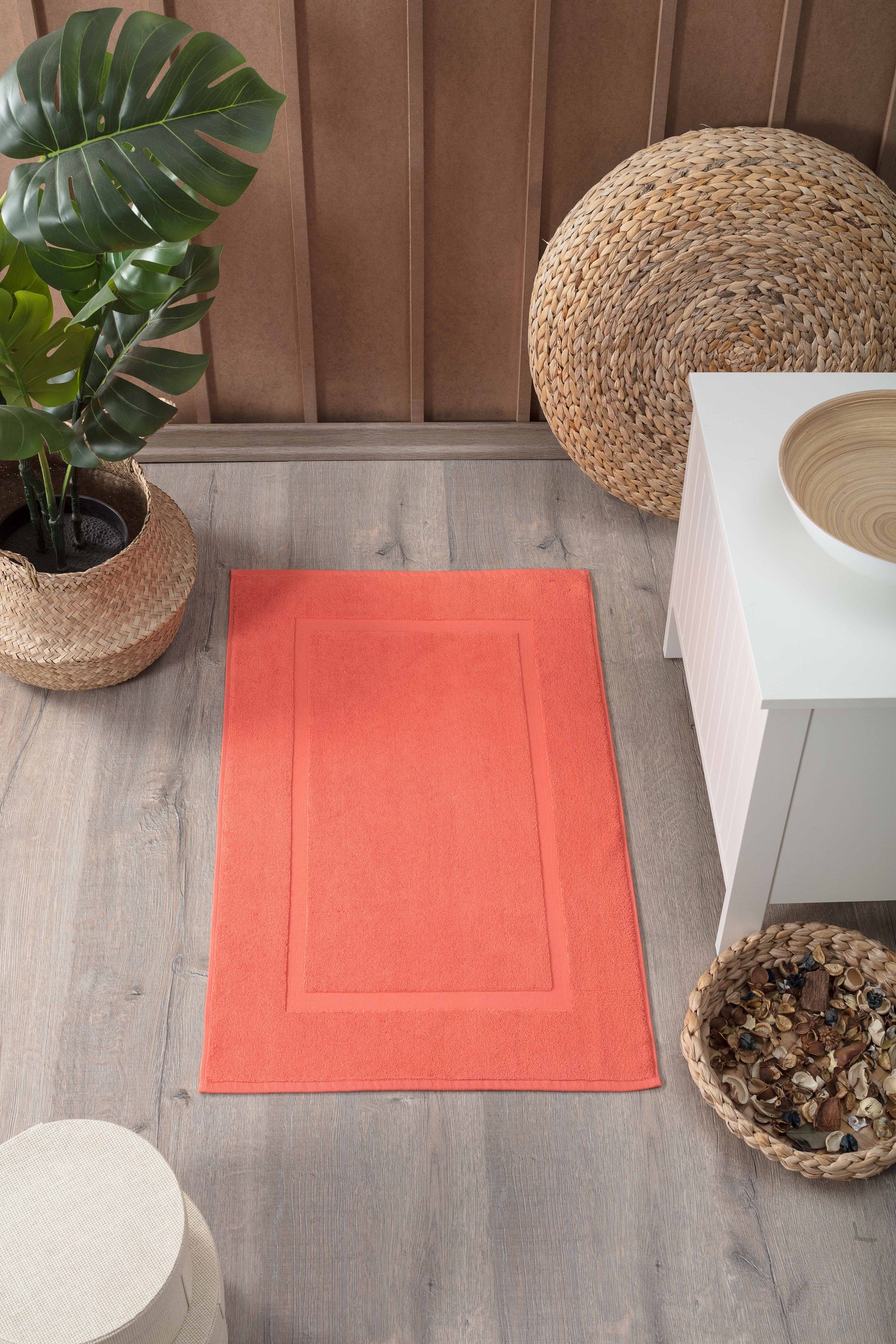 Two luxurious Turkish cotton bath mats in a stylish design, showcasing their plush texture and dobby weave border.