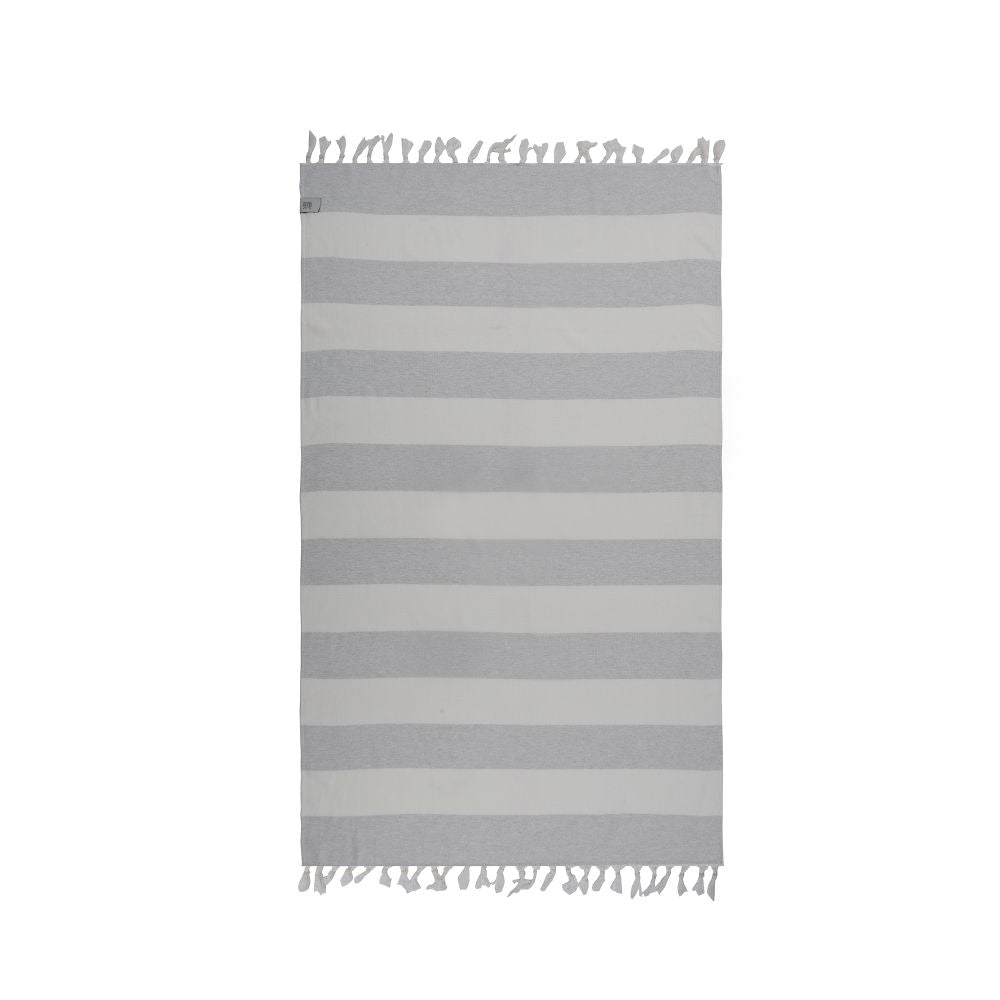 Violet Beach Towel made of soft Turkish cotton with white fringes, perfect for beach or home use.