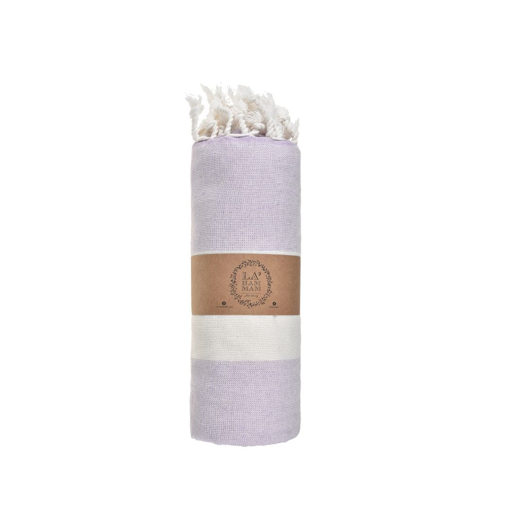 Violet Beach Towel made of soft Turkish cotton with white fringes, perfect for beach or home use.