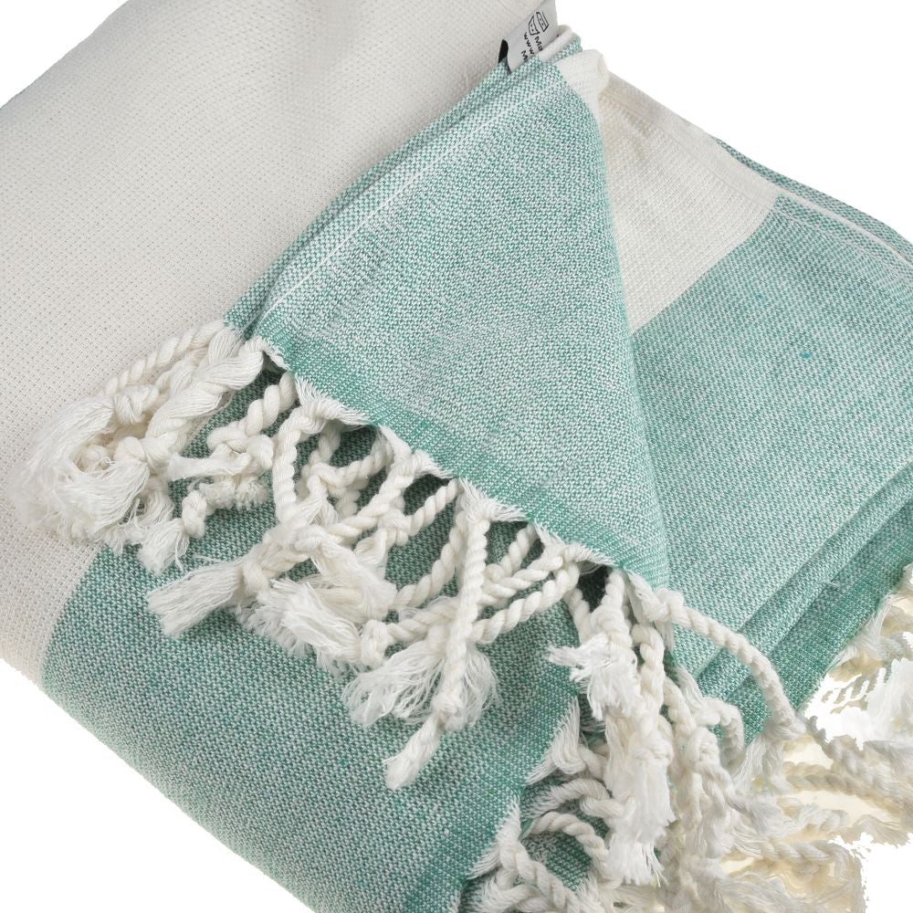 Violet Beach Towel made of soft Turkish cotton with white fringes, perfect for beach or home use.