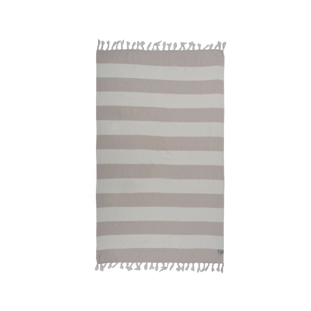 Violet Beach Towel made of soft Turkish cotton with white fringes, perfect for beach or home use.