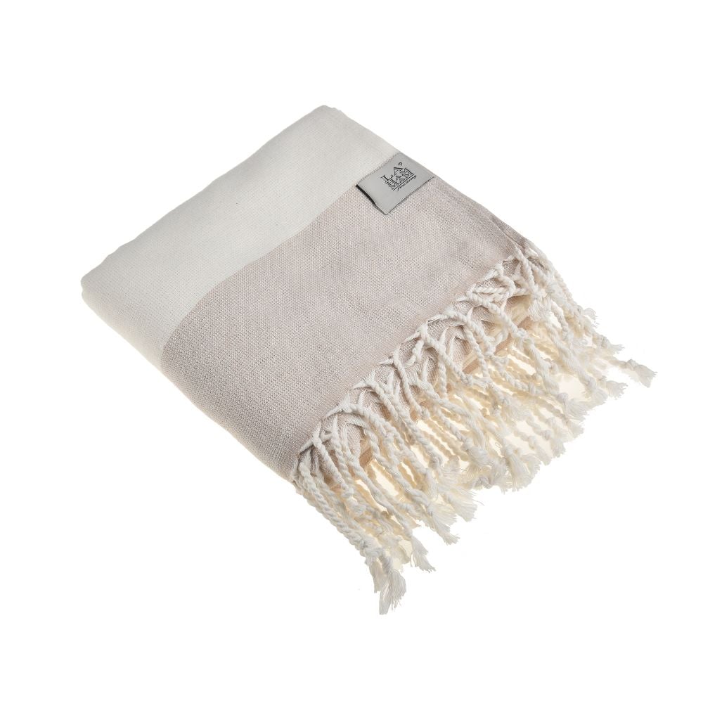 Violet Beach Towel made of soft Turkish cotton with white fringes, perfect for beach or home use.