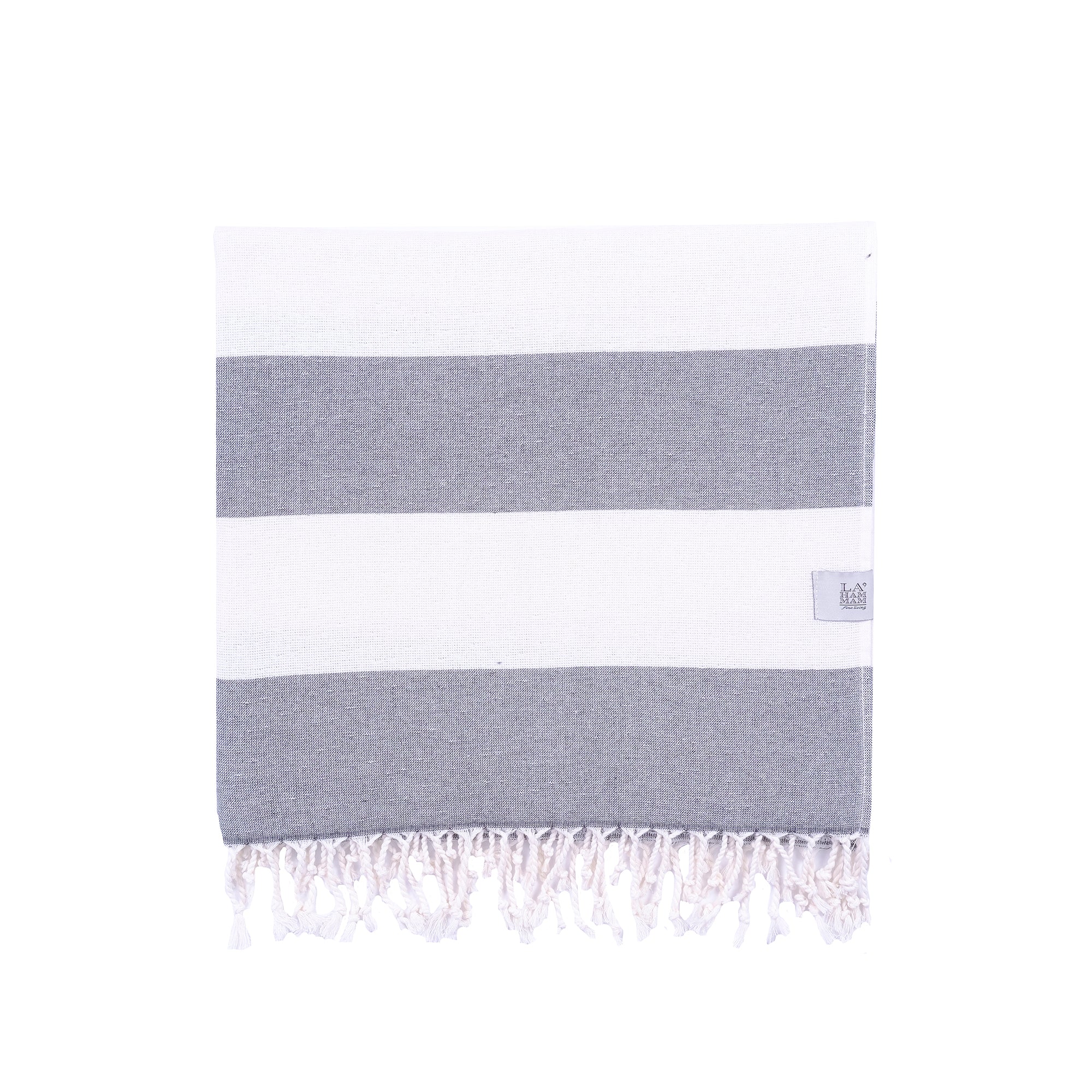 Violet Beach Towel made of soft Turkish cotton with white fringes, perfect for beach or home use.